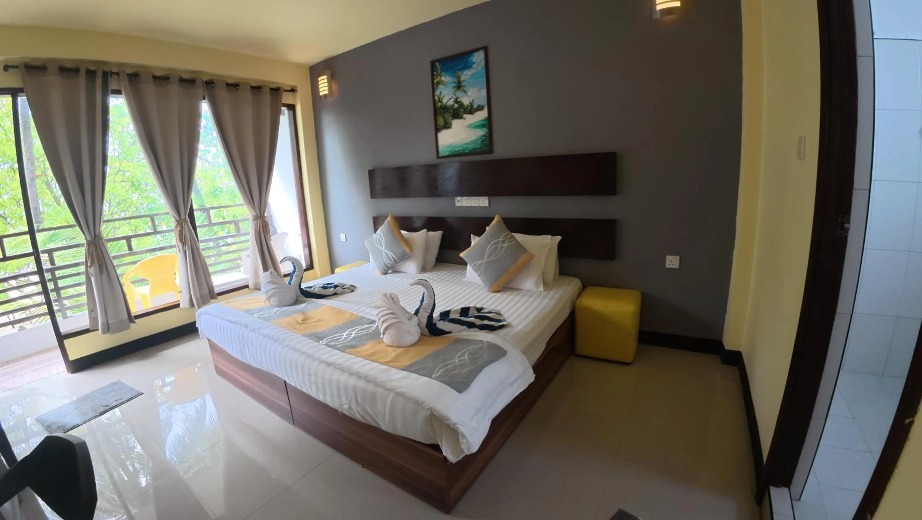 Bed in Liberty Guesthouse Maldives