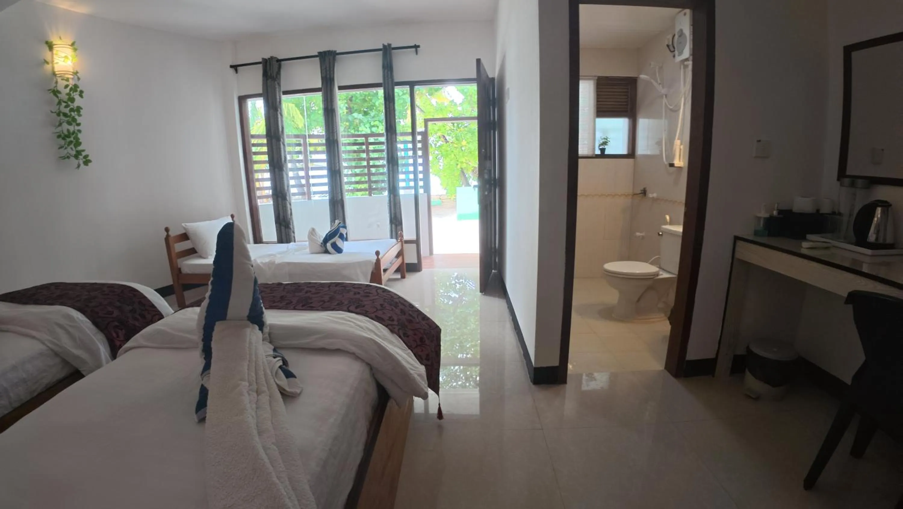 Bed in Liberty Guesthouse Maldives