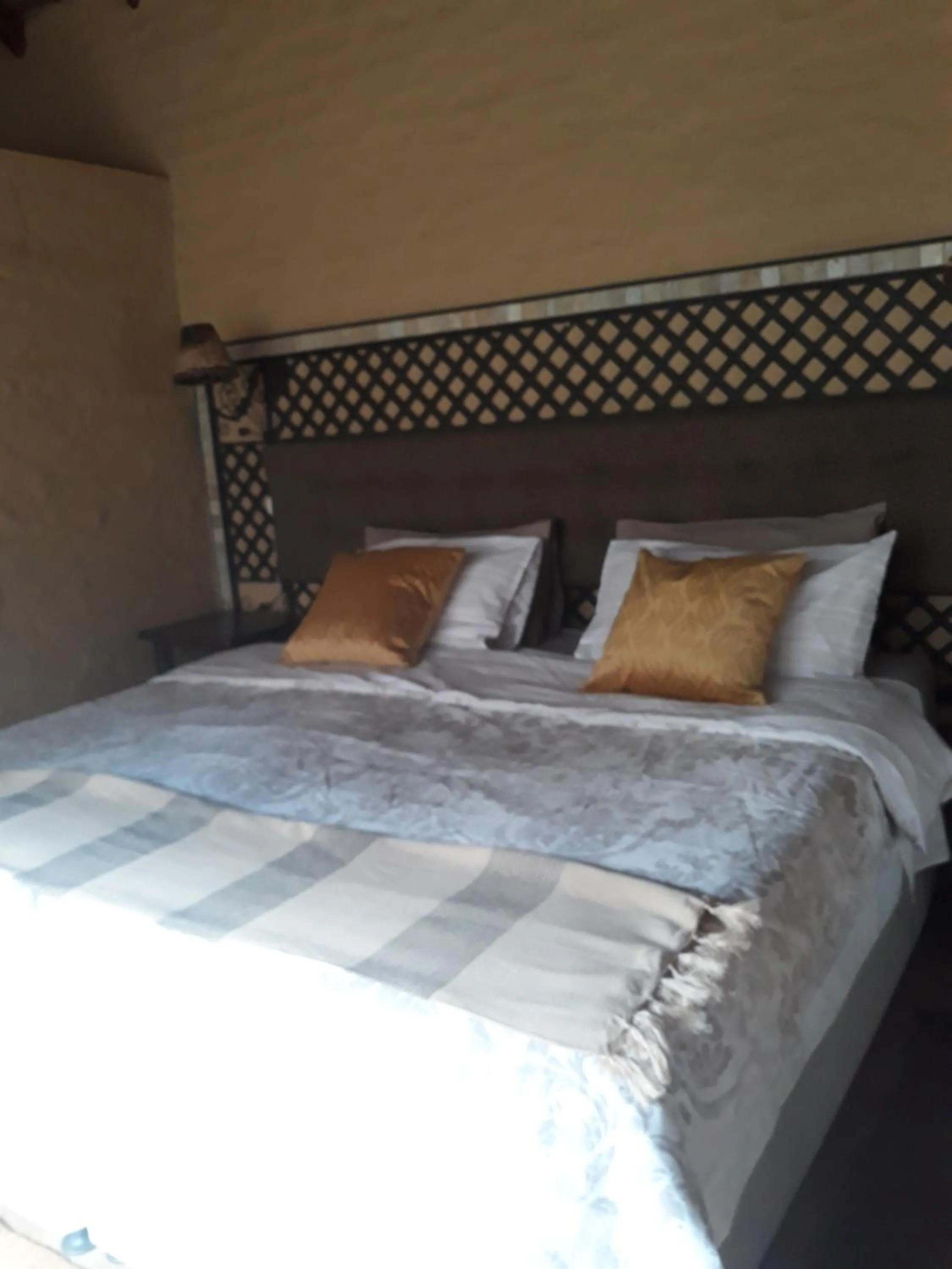 Bed in African Silhouette Guesthouse