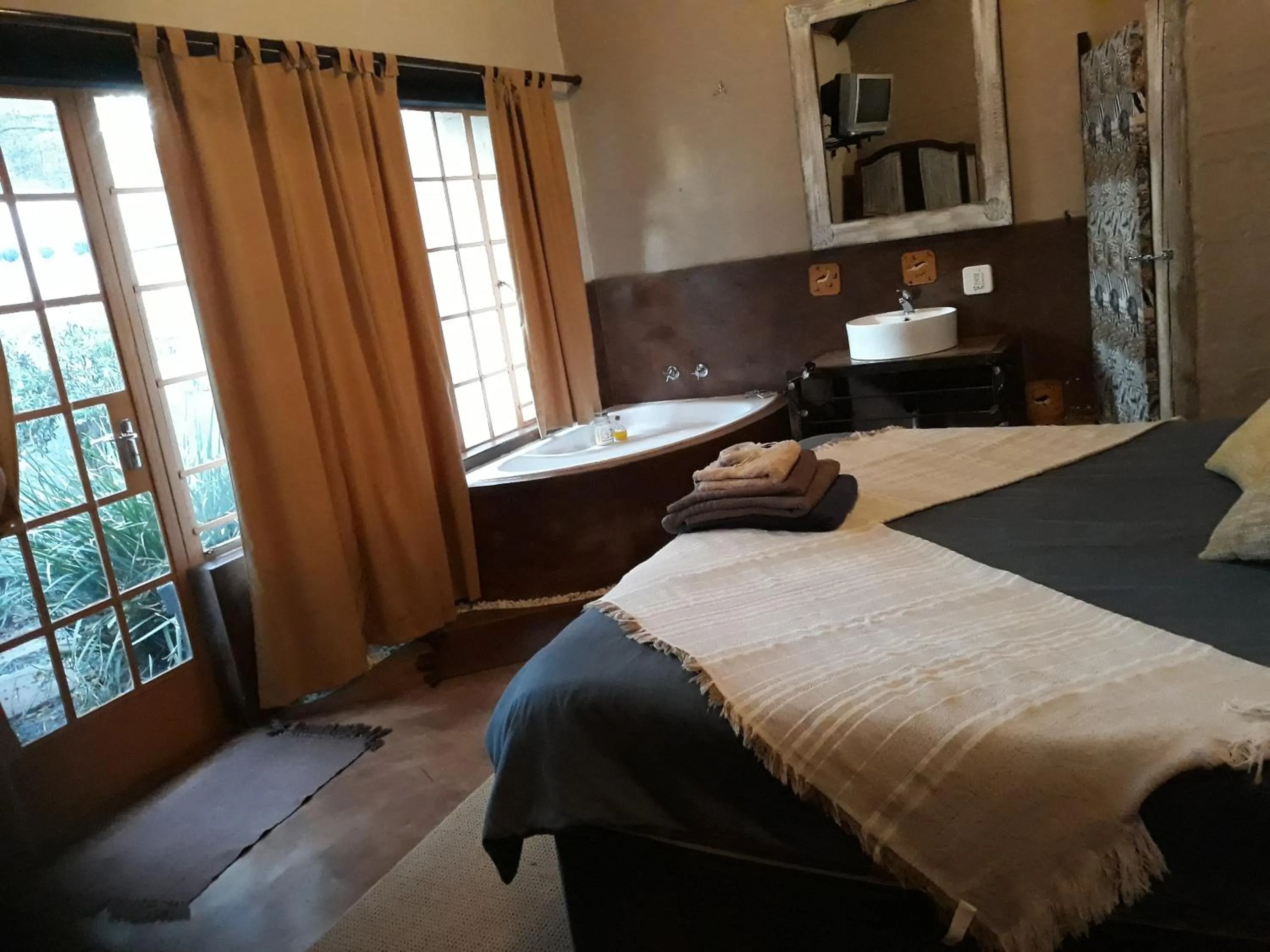 Bed in African Silhouette Guesthouse