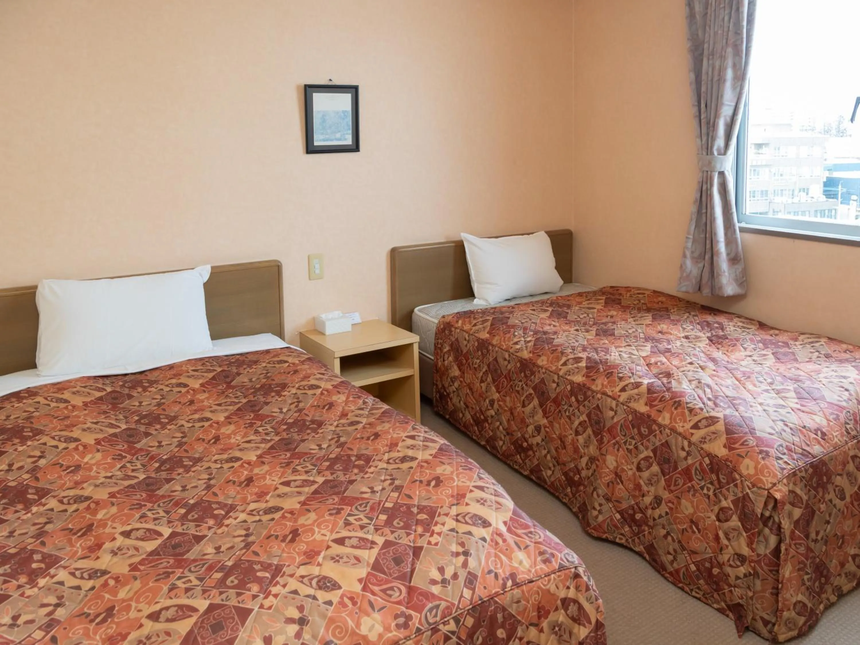 Bed in Tabist Hirosaki Touei Hotel