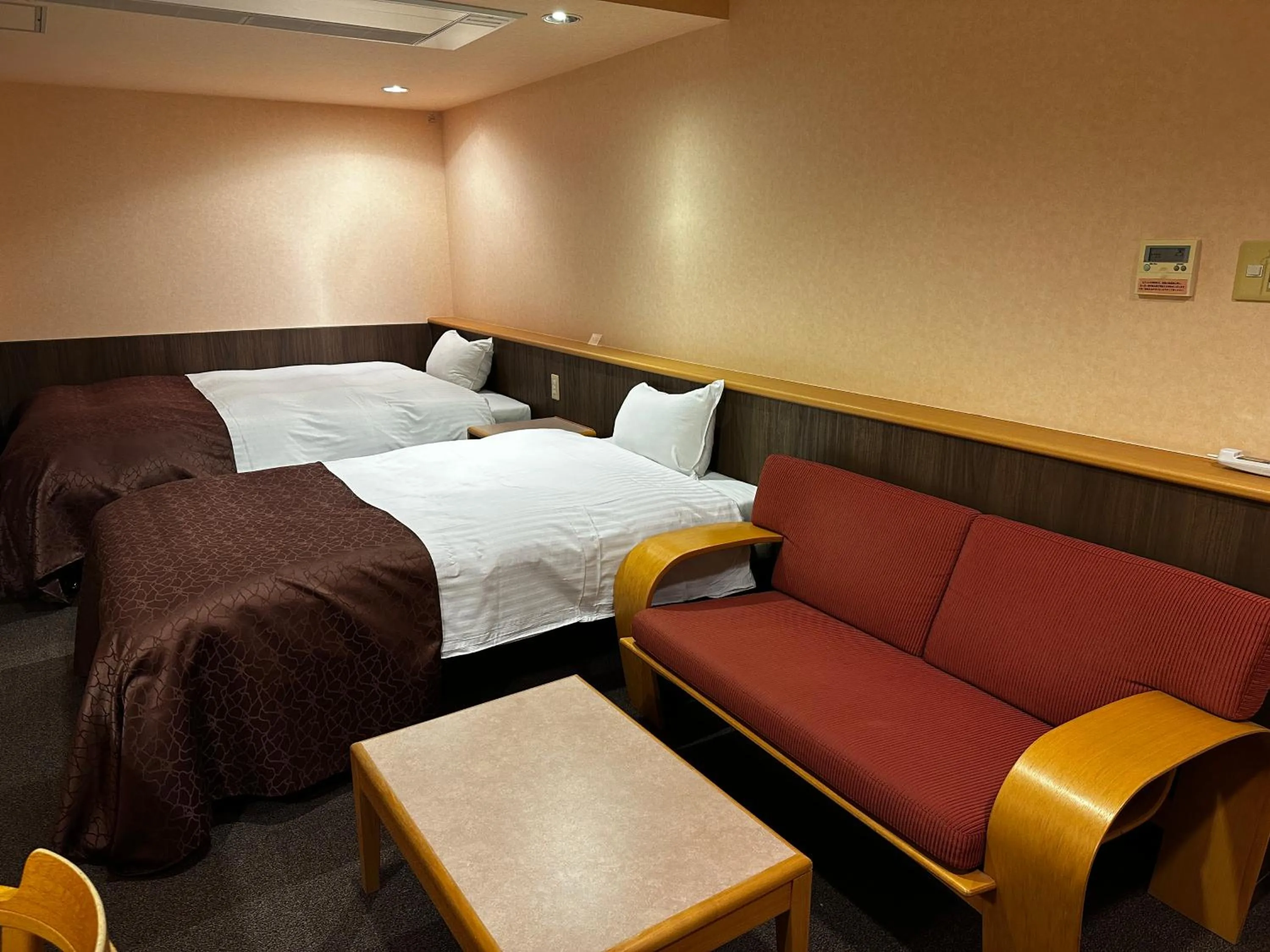 Bed in Tabist Hirosaki Touei Hotel