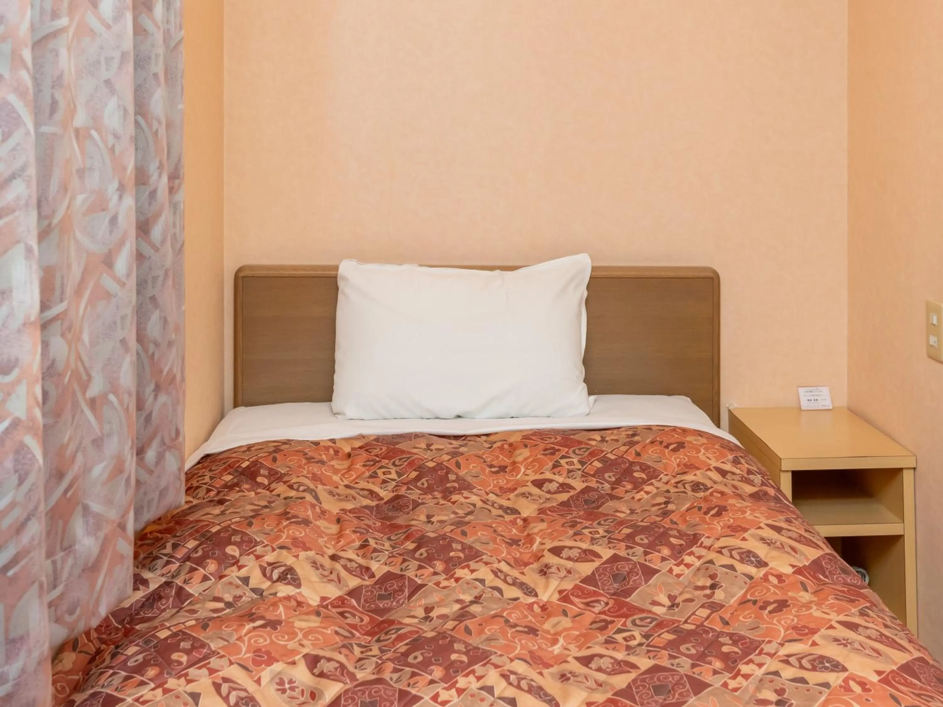 Bed in Tabist Hirosaki Touei Hotel