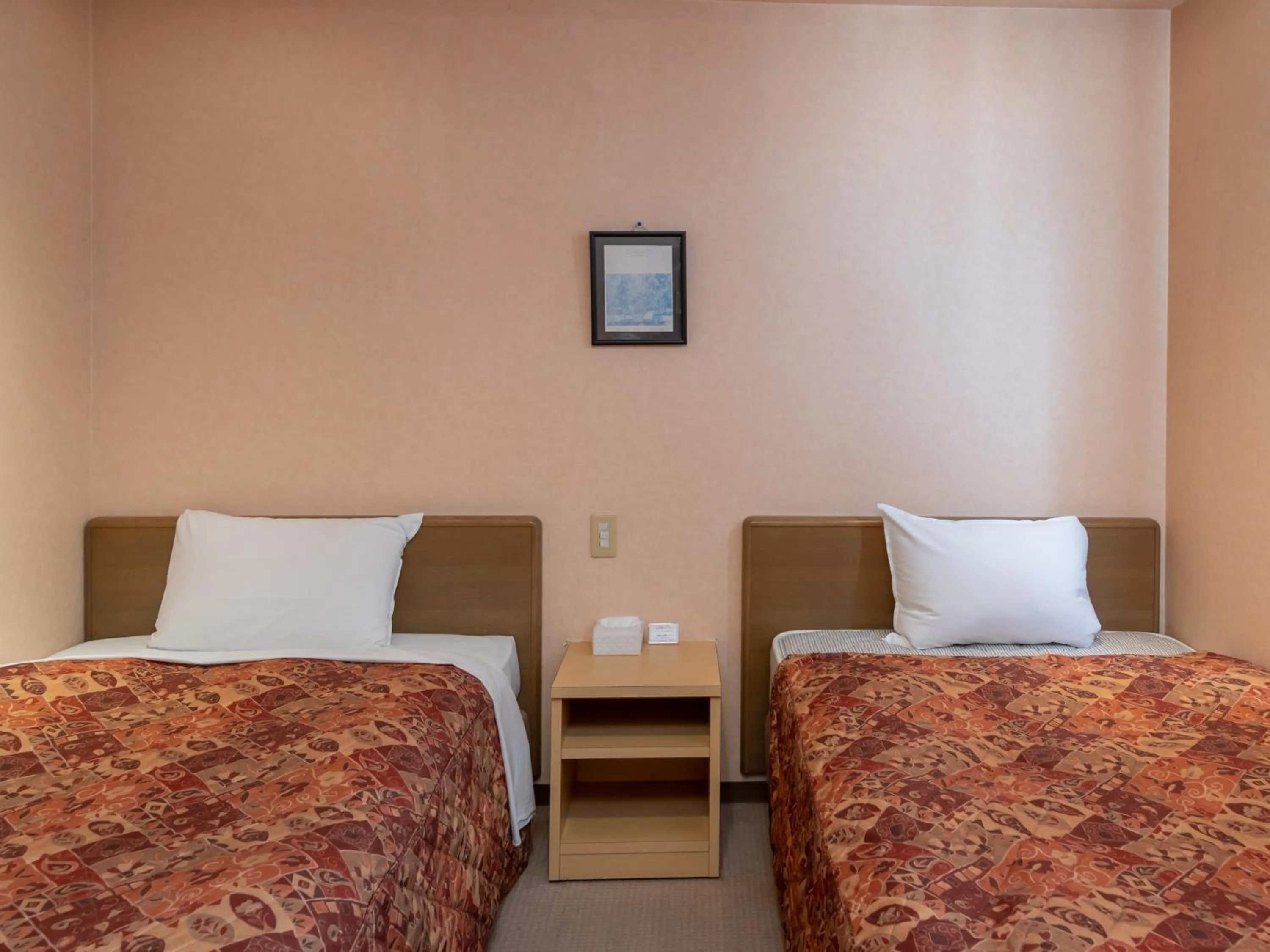 Bed in Tabist Hirosaki Touei Hotel