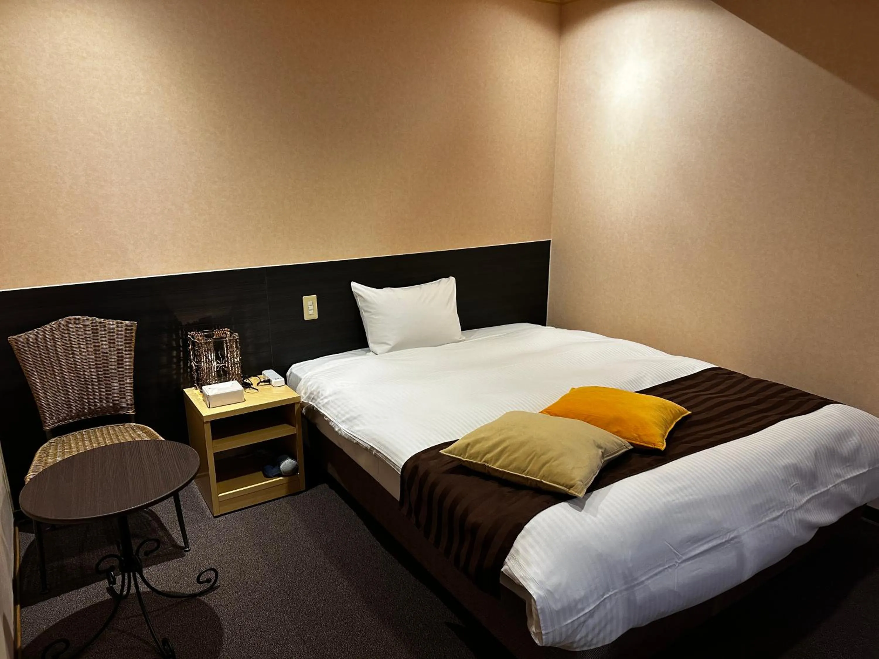 Bed in Tabist Hirosaki Touei Hotel