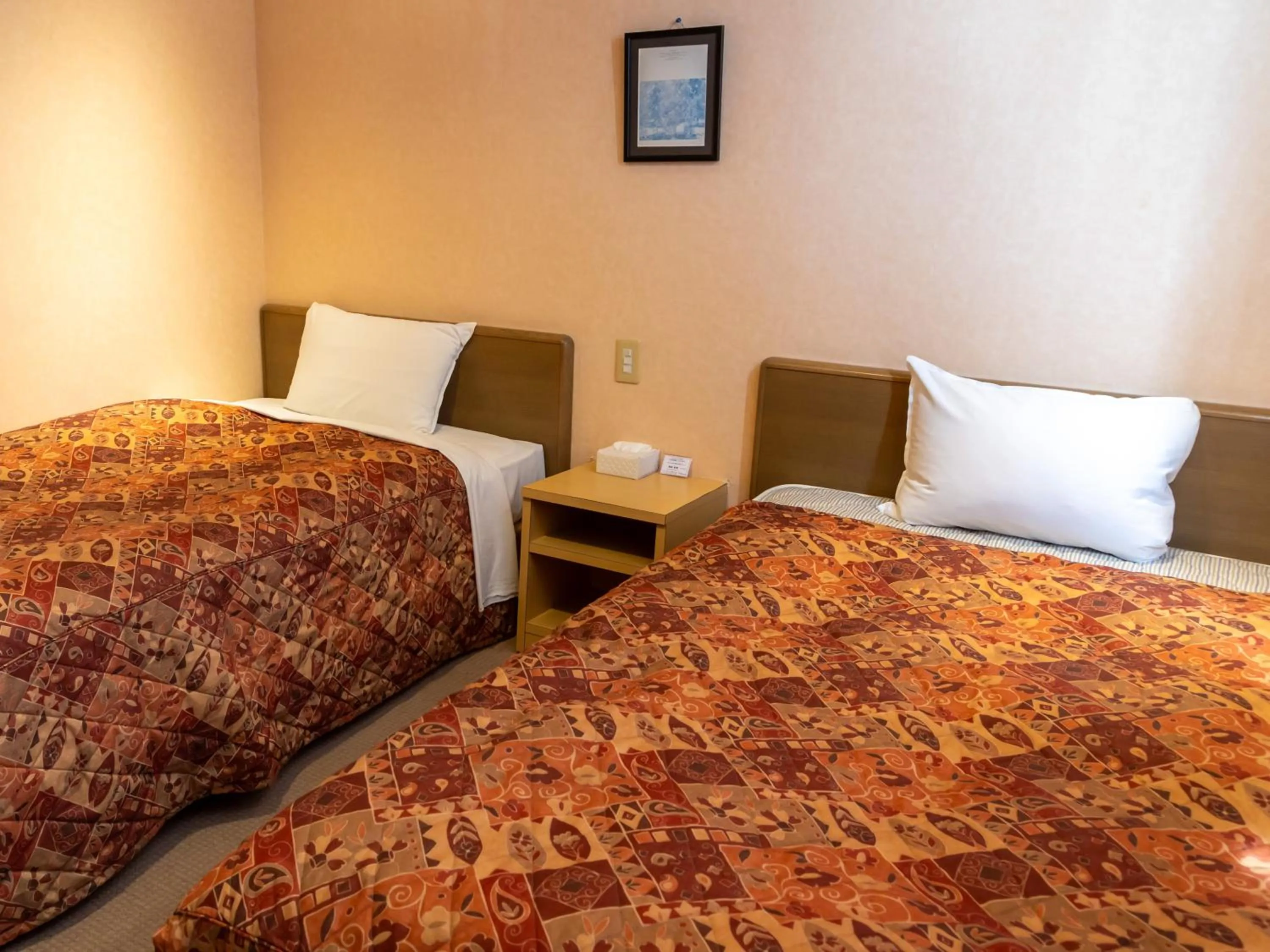 Bed in Tabist Hirosaki Touei Hotel