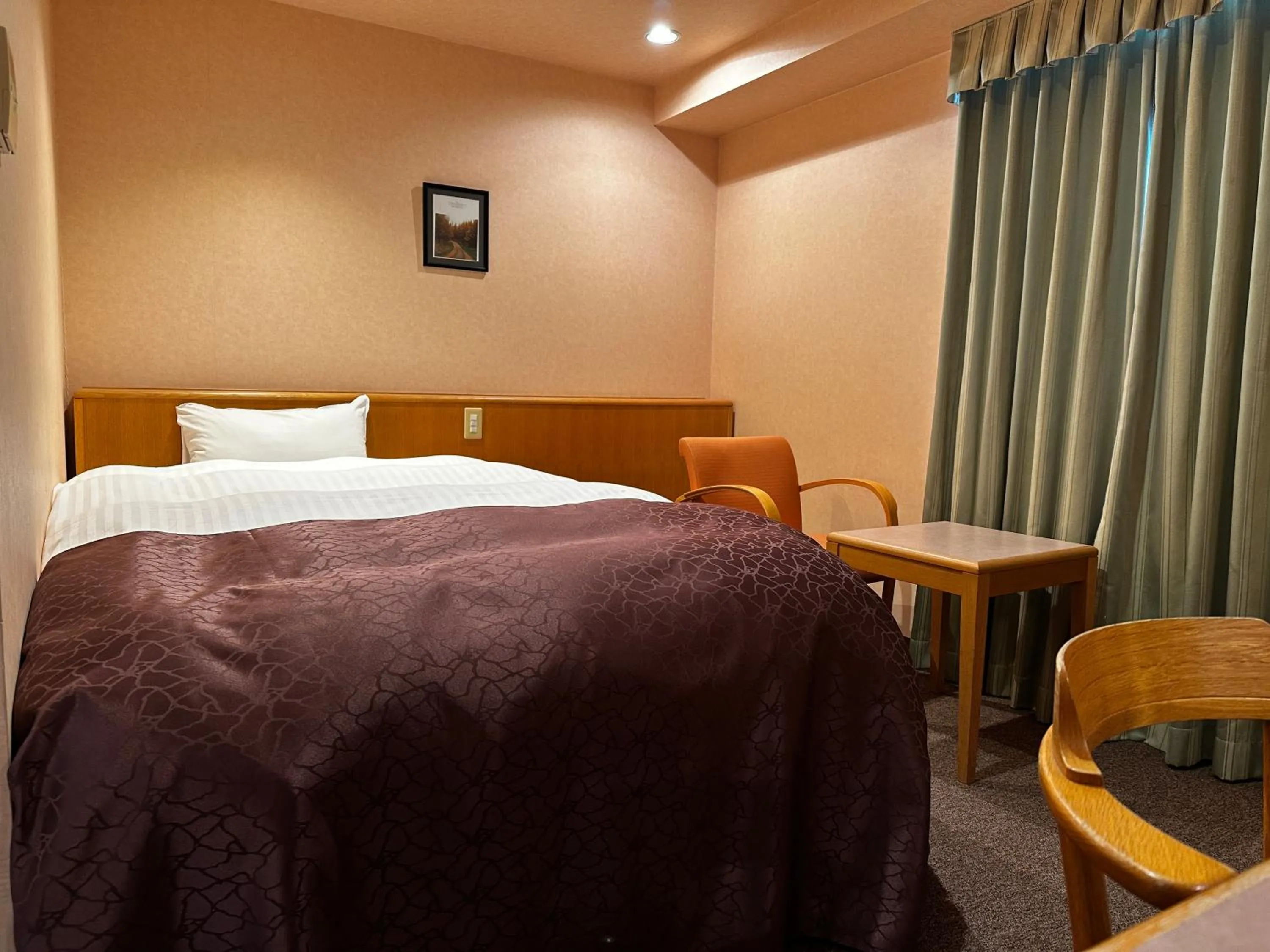 Bed in Tabist Hirosaki Touei Hotel