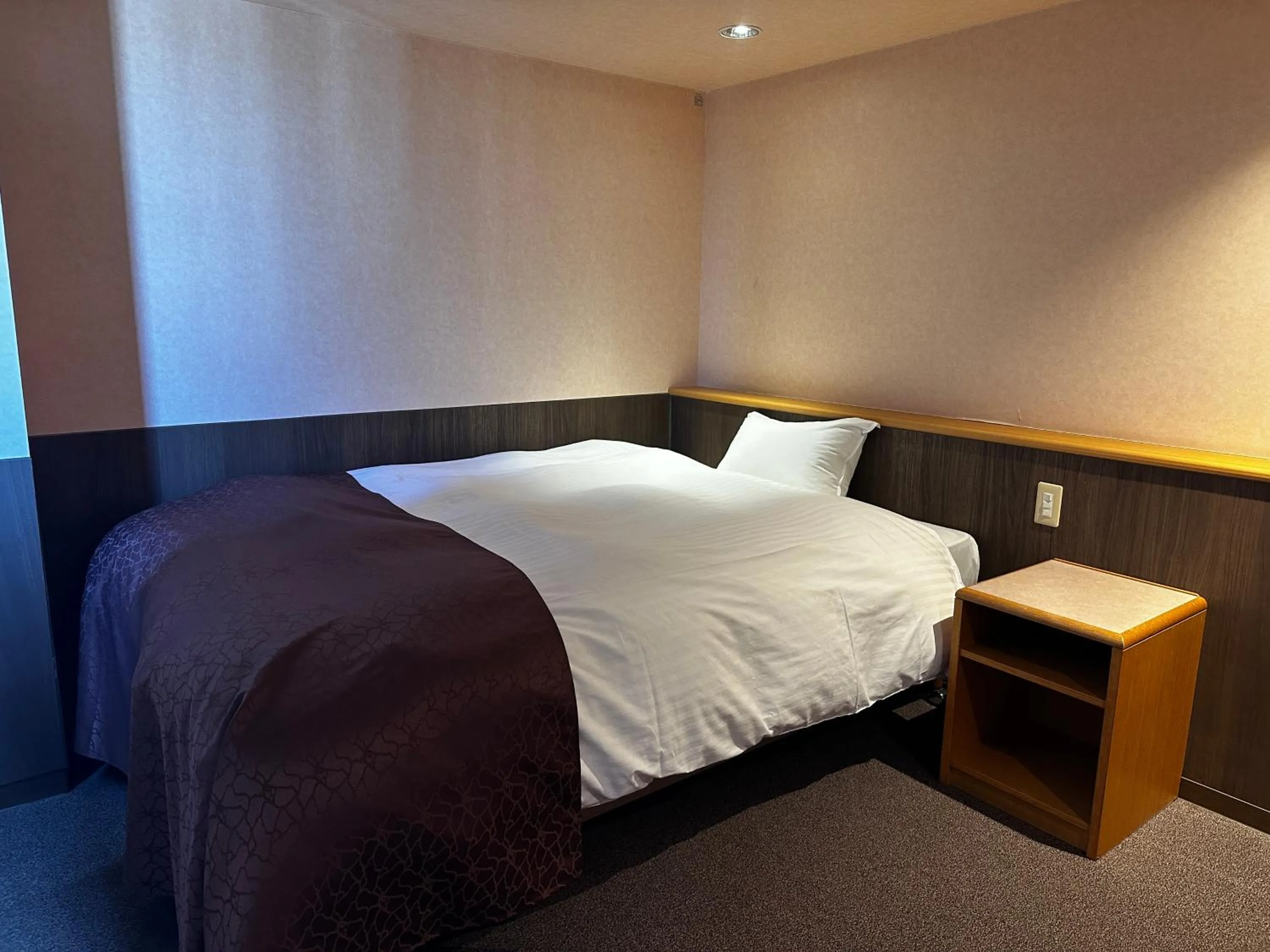 Bed in Tabist Hirosaki Touei Hotel