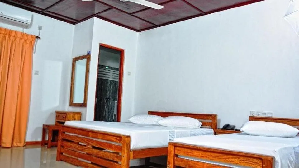 Bed in Rajarata Family Resort