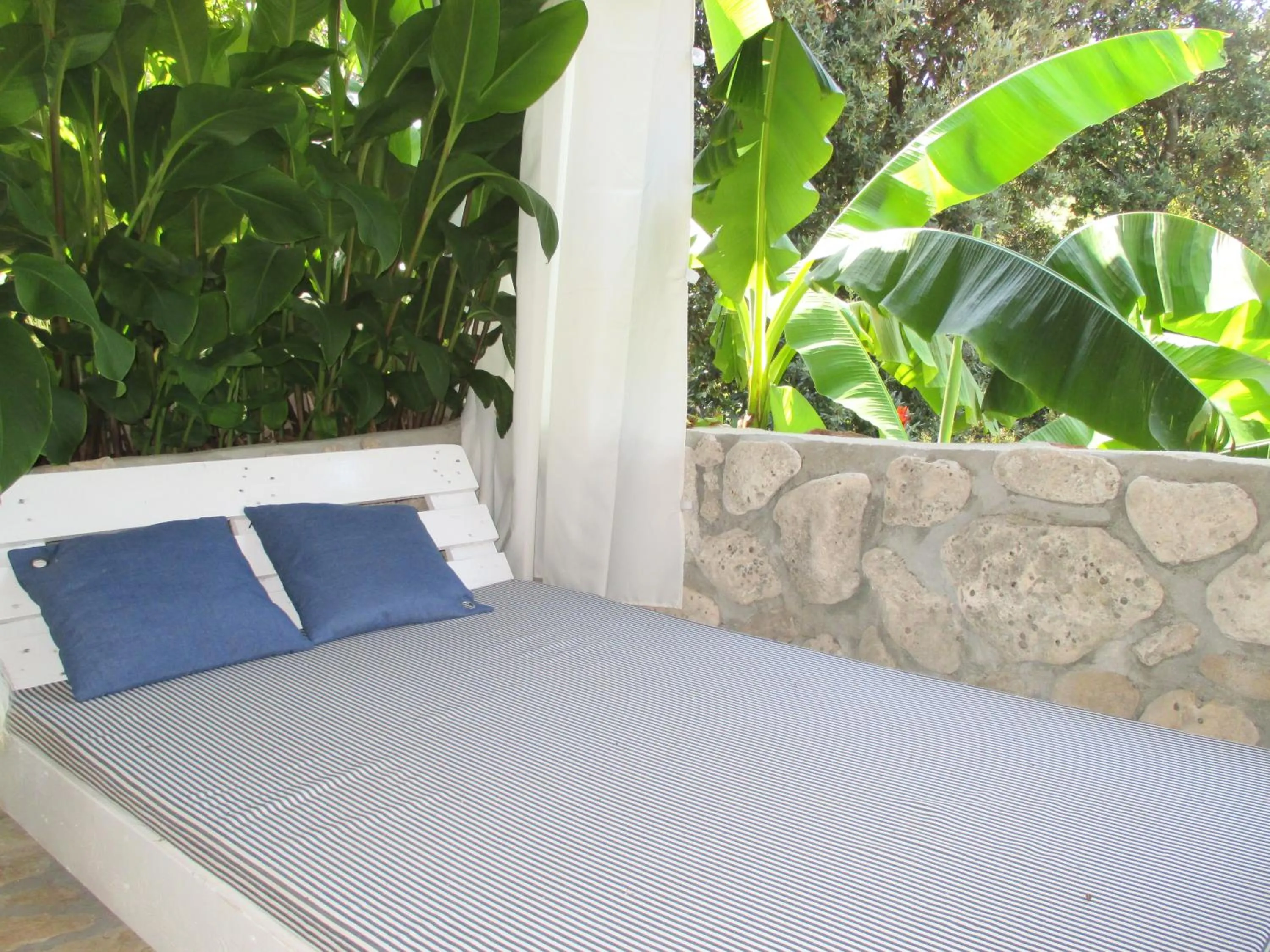 Balcony/Terrace, Bed in Relax tiny villas 40 meters of the beach