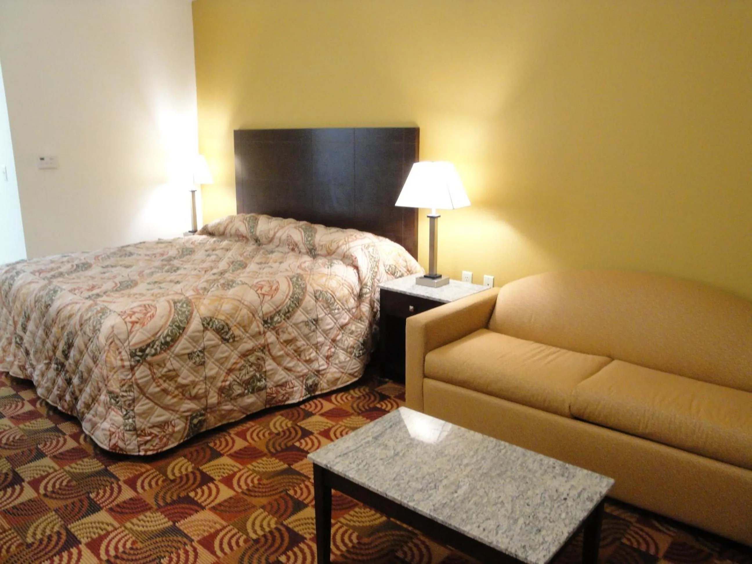 Bed in Sands Inn & Suites