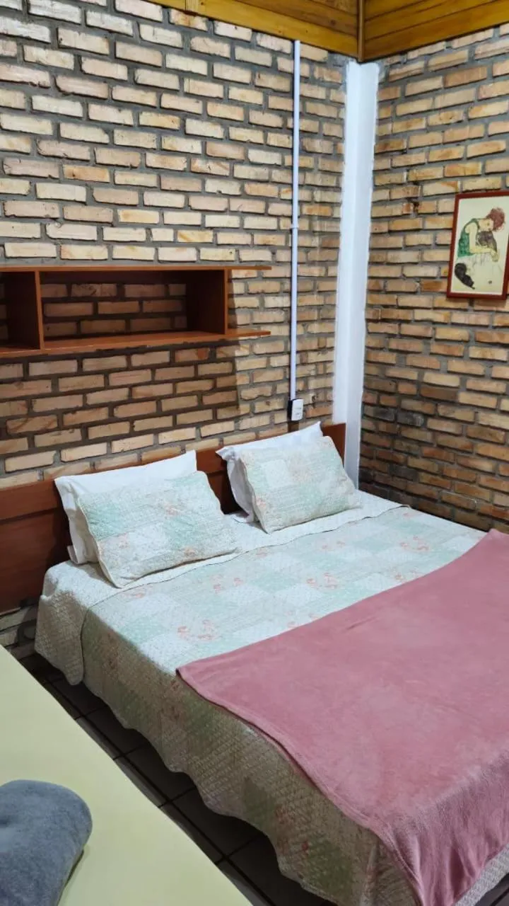 Bed in Pousada Marujo