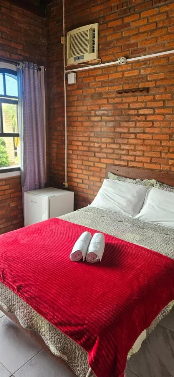 Bed in Pousada Marujo