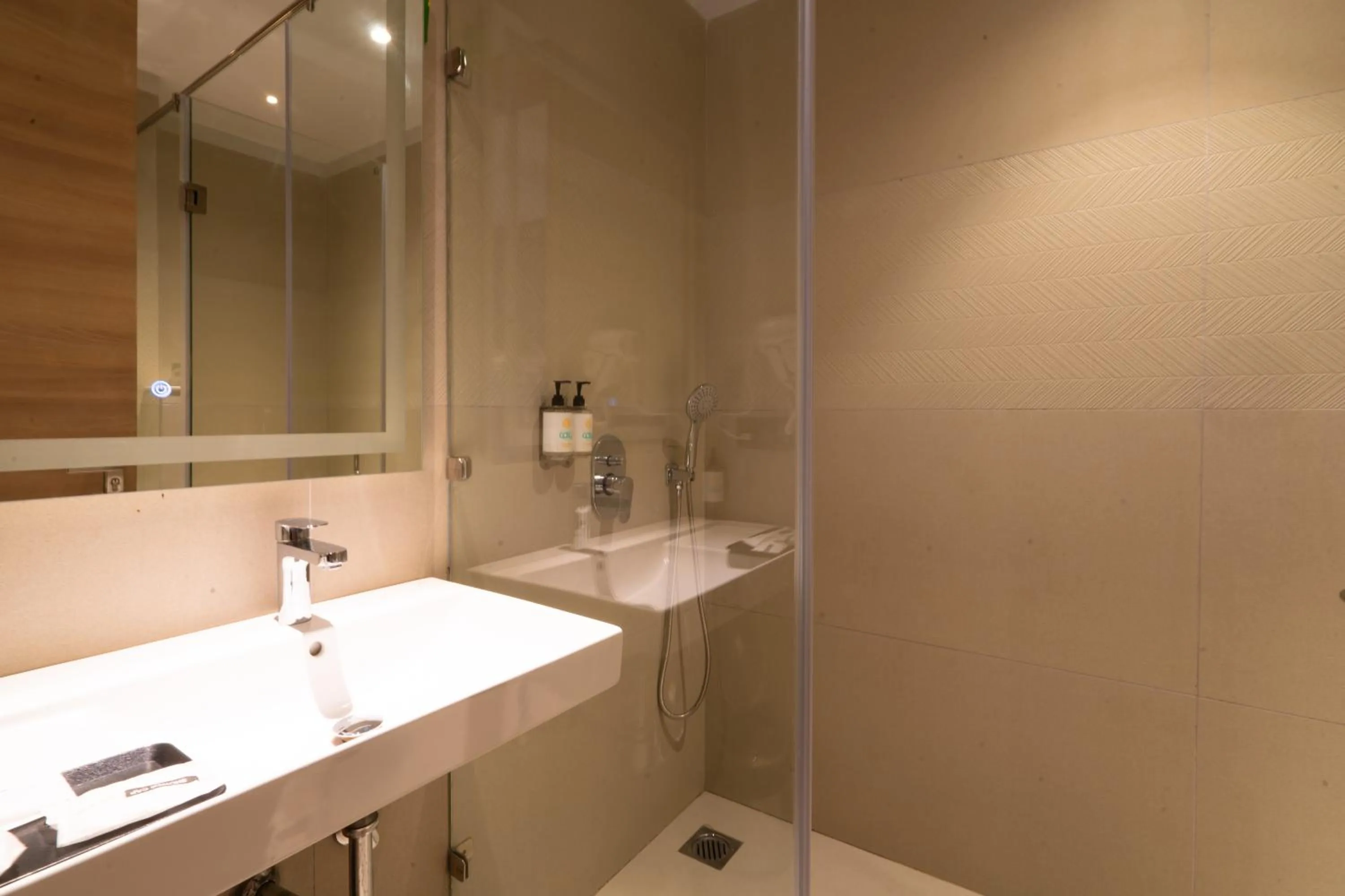 Shower in Hotel Bluestone Prime Nehru Place by The Cosy hotels