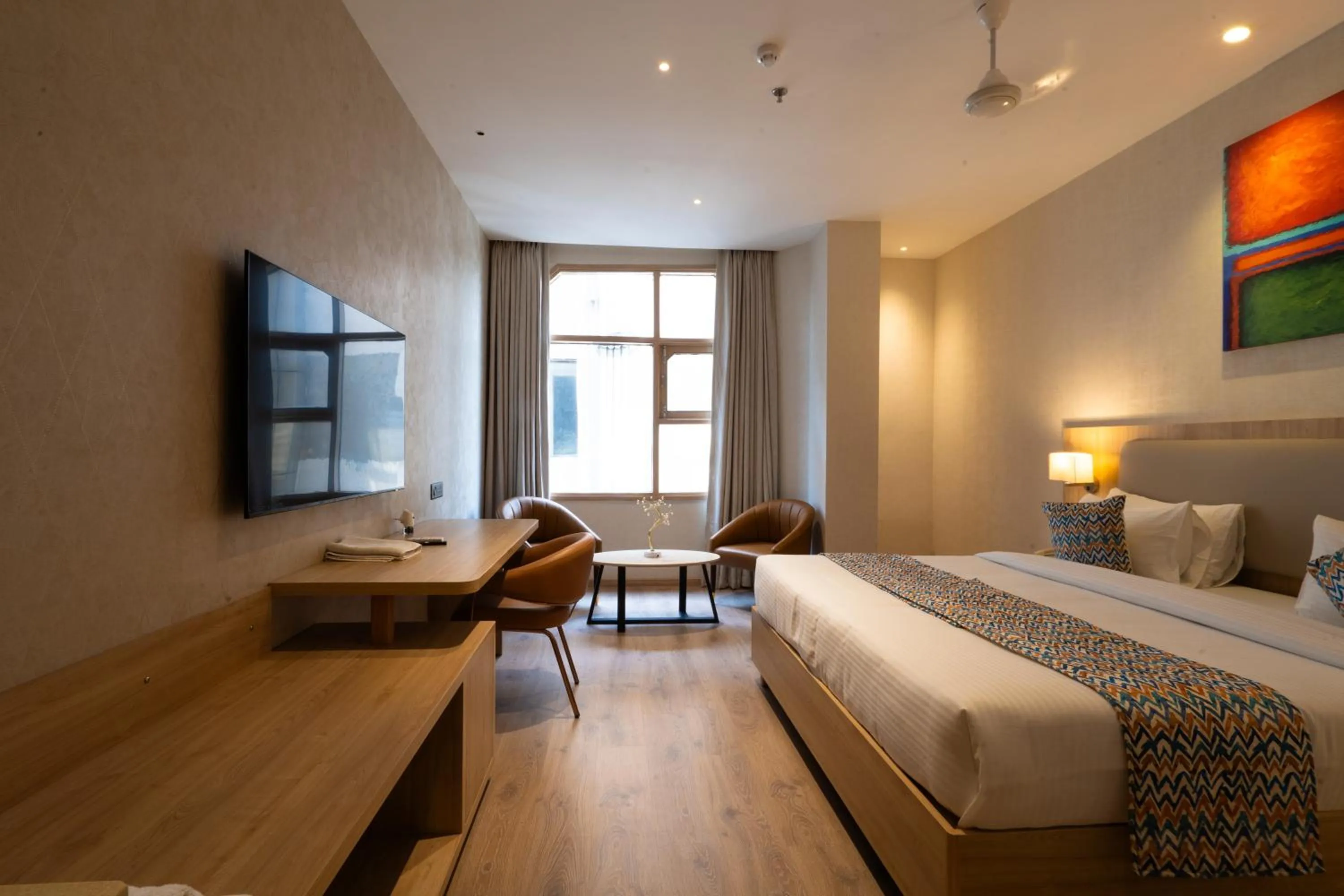 Photo of the whole room, Bed in Hotel Bluestone Prime Nehru Place by The Cosy hotels