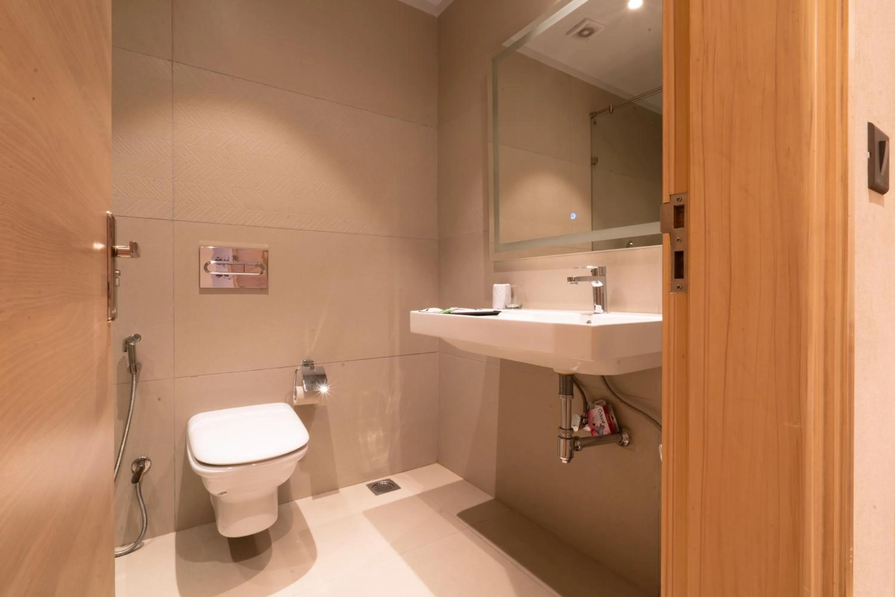Bathroom in Hotel Bluestone Prime Nehru Place by The Cosy hotels
