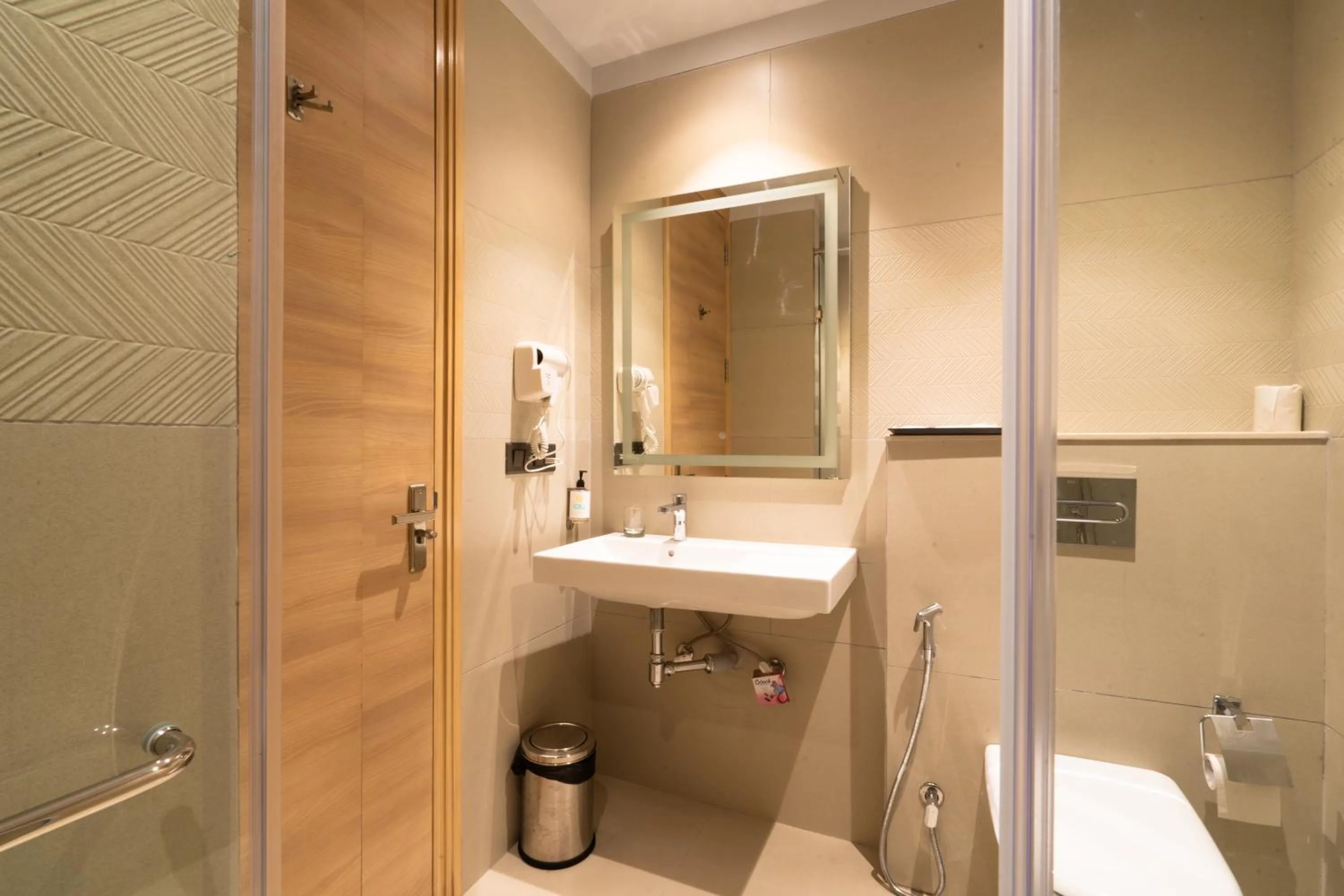 Bathroom in Hotel Bluestone Prime Nehru Place by The Cosy hotels