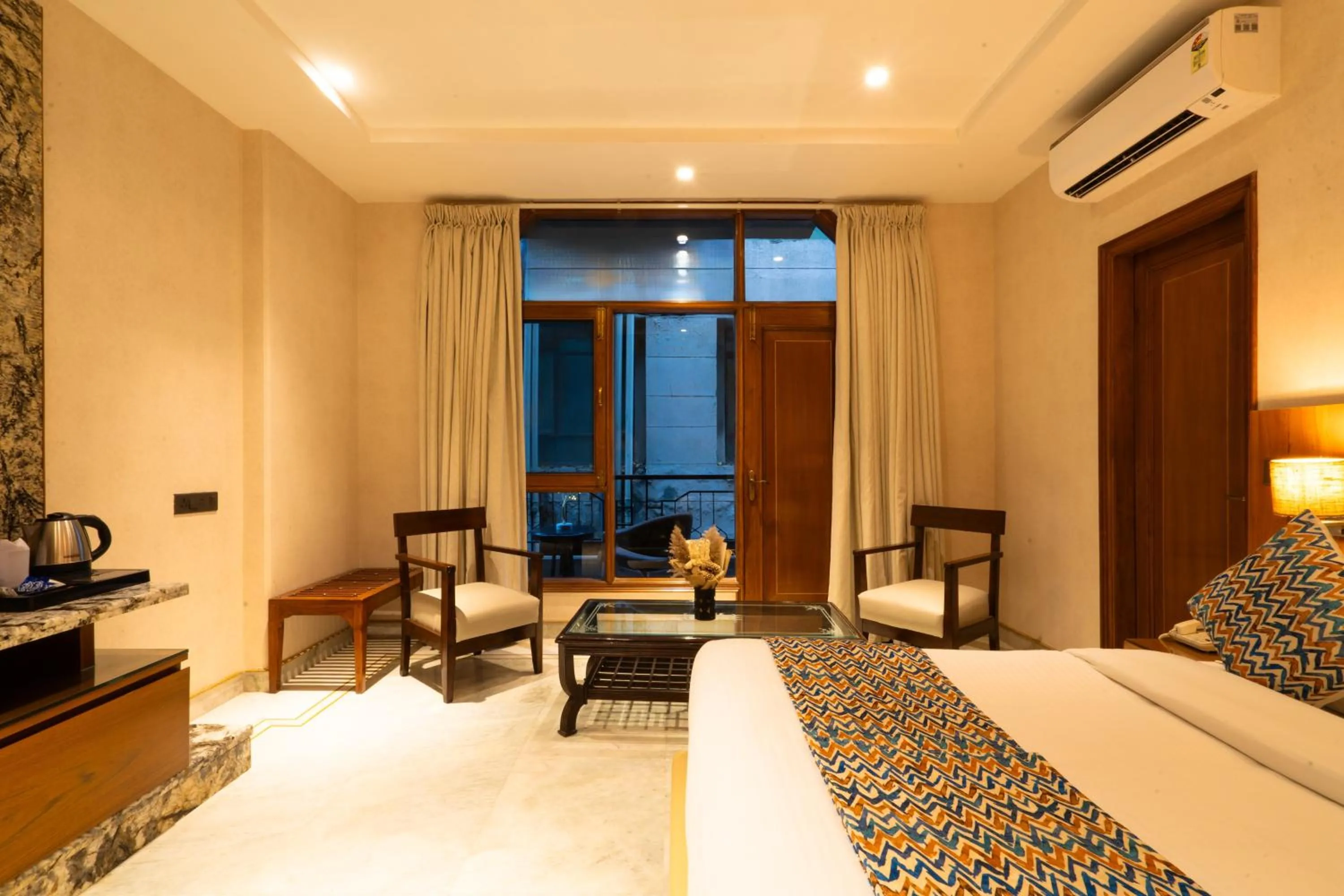 Photo of the whole room, Bed in Hotel Bluestone Prime Nehru Place by The Cosy hotels