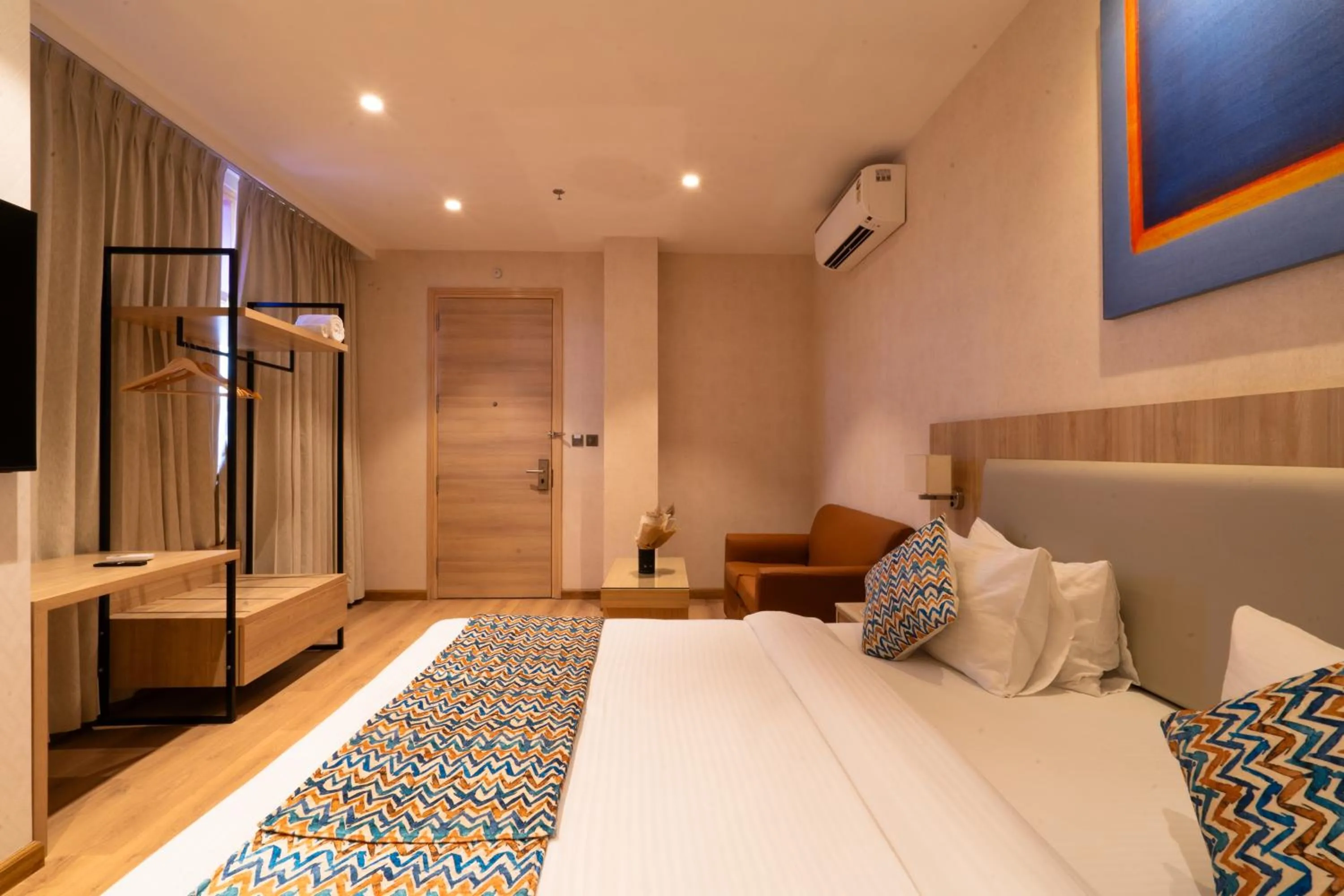 Photo of the whole room, Bed in Hotel Bluestone Prime Nehru Place by The Cosy hotels