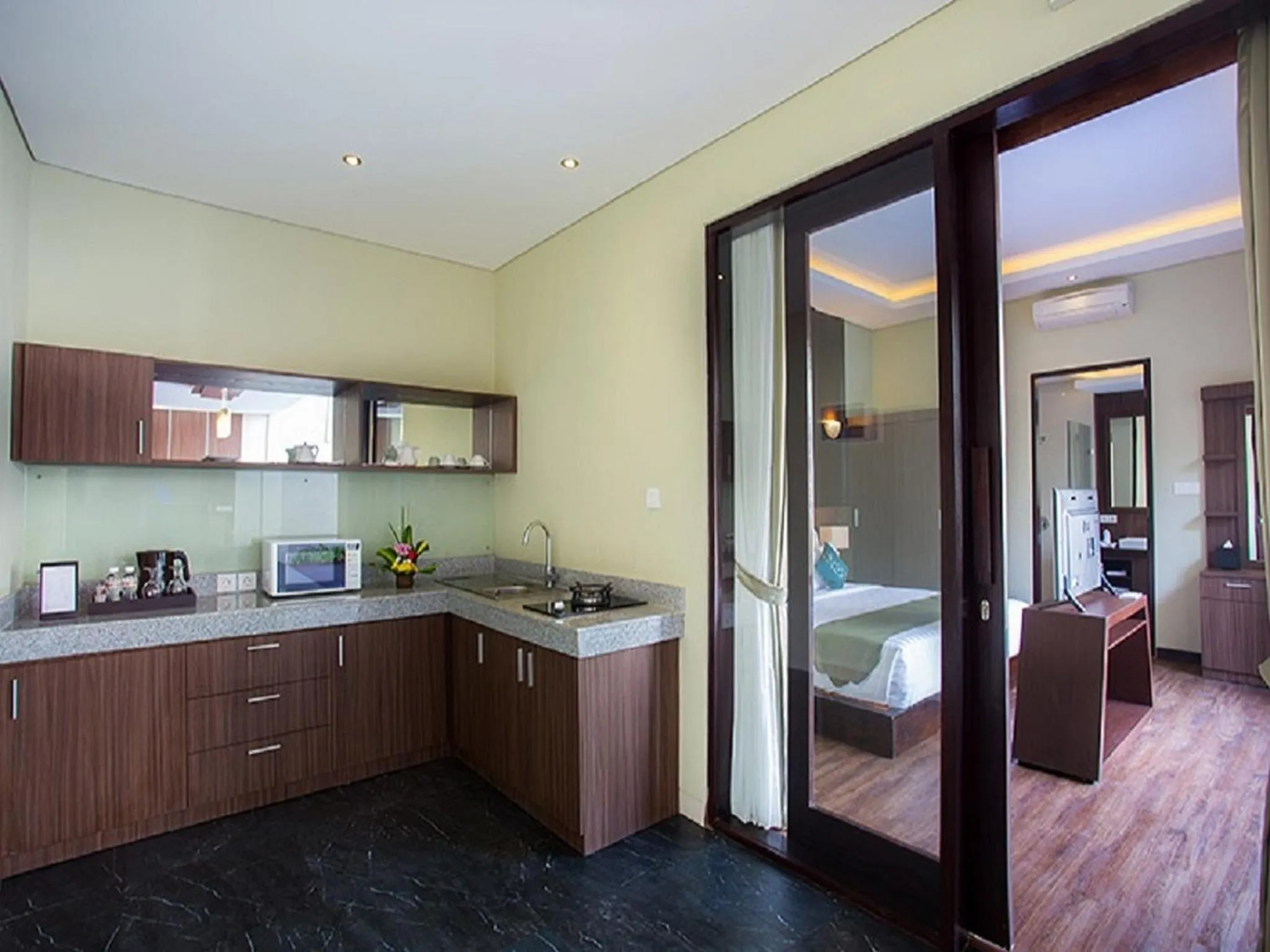 Kitchen or kitchenette, Bed in Buana Bali Villas & Spa