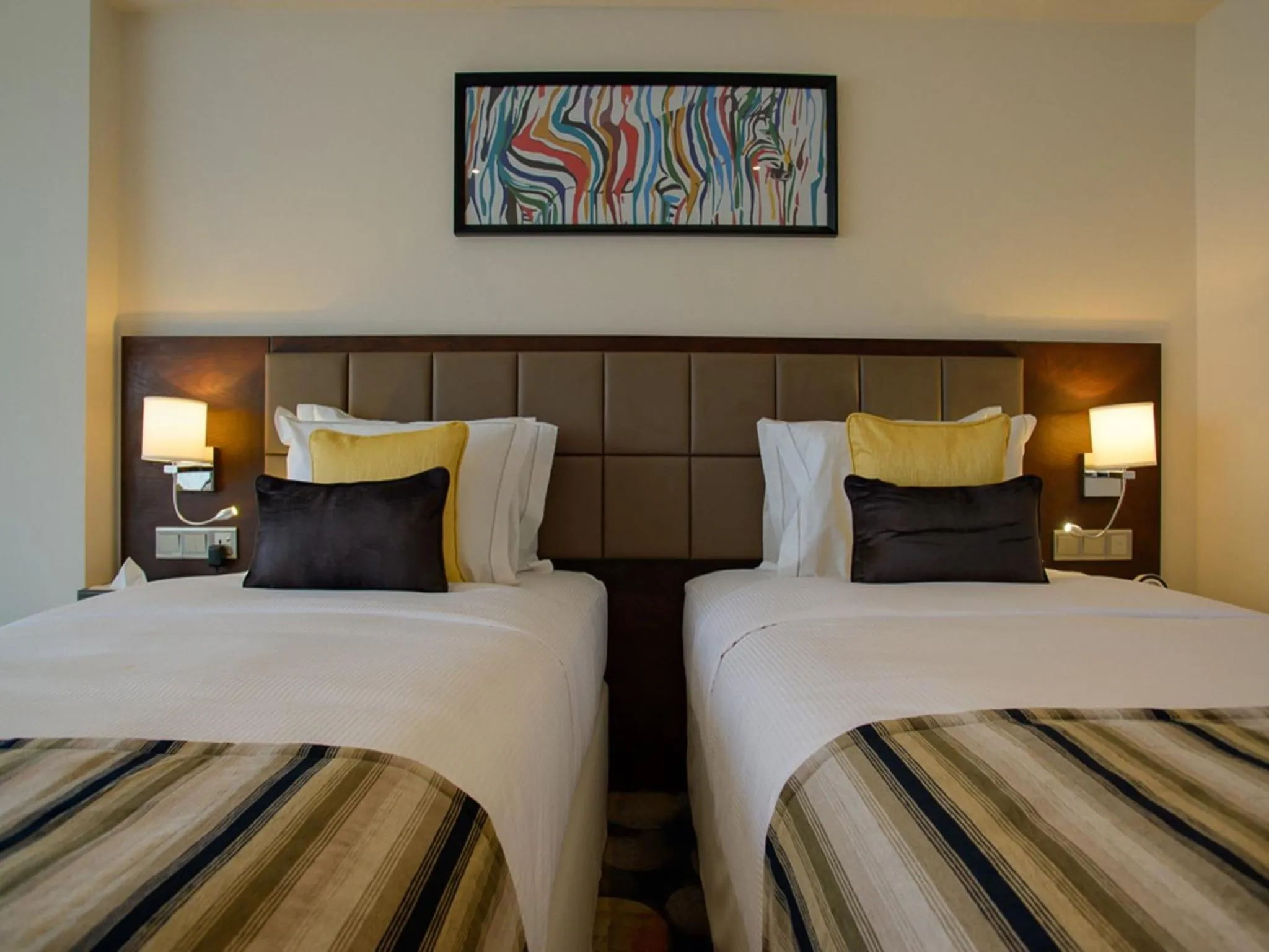 Bed in The Concord Hotel & Suites