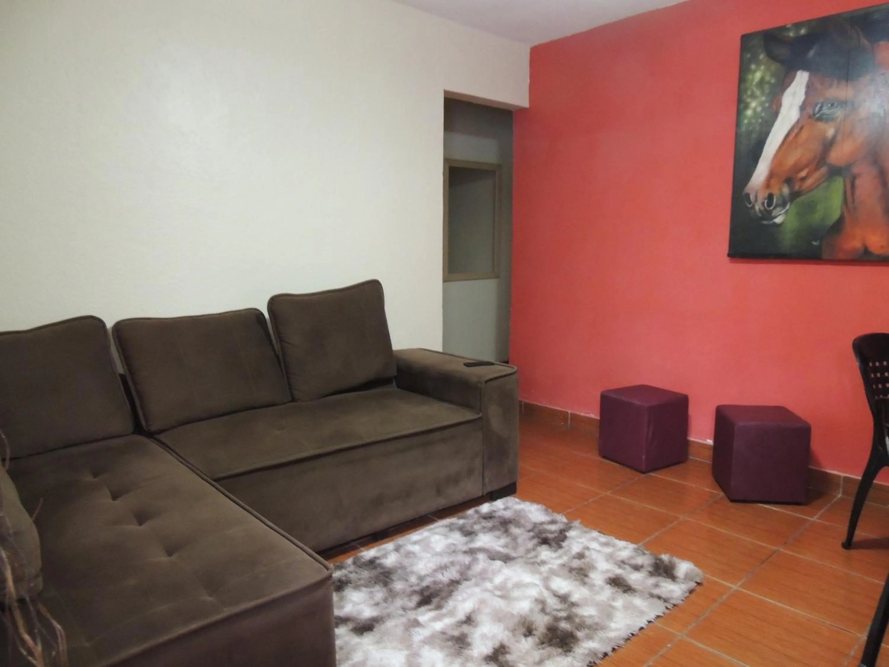 Living room in Quartos Em Casa In Caxias da Paraíso