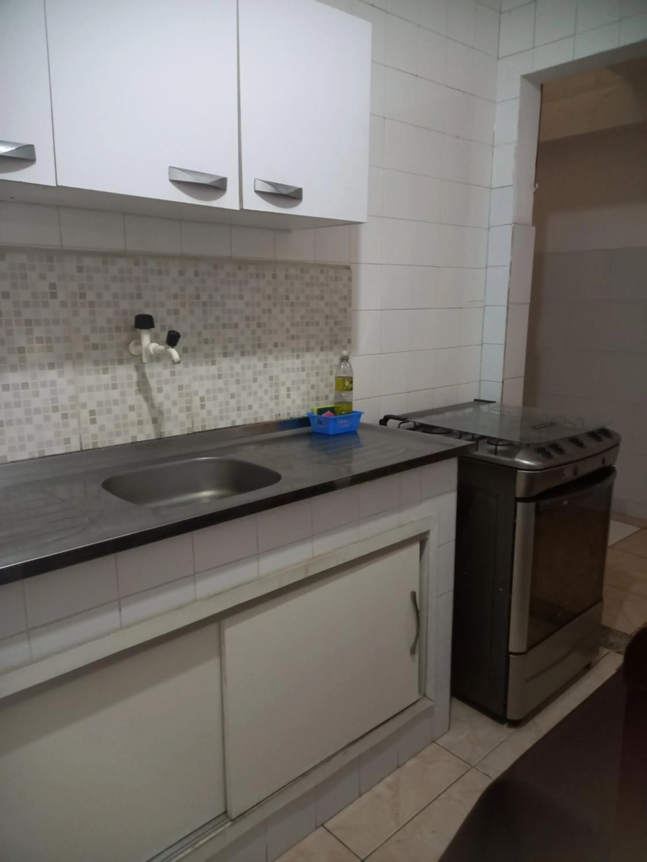 Kitchen or kitchenette in Quartos Em Casa In Caxias da Paraíso