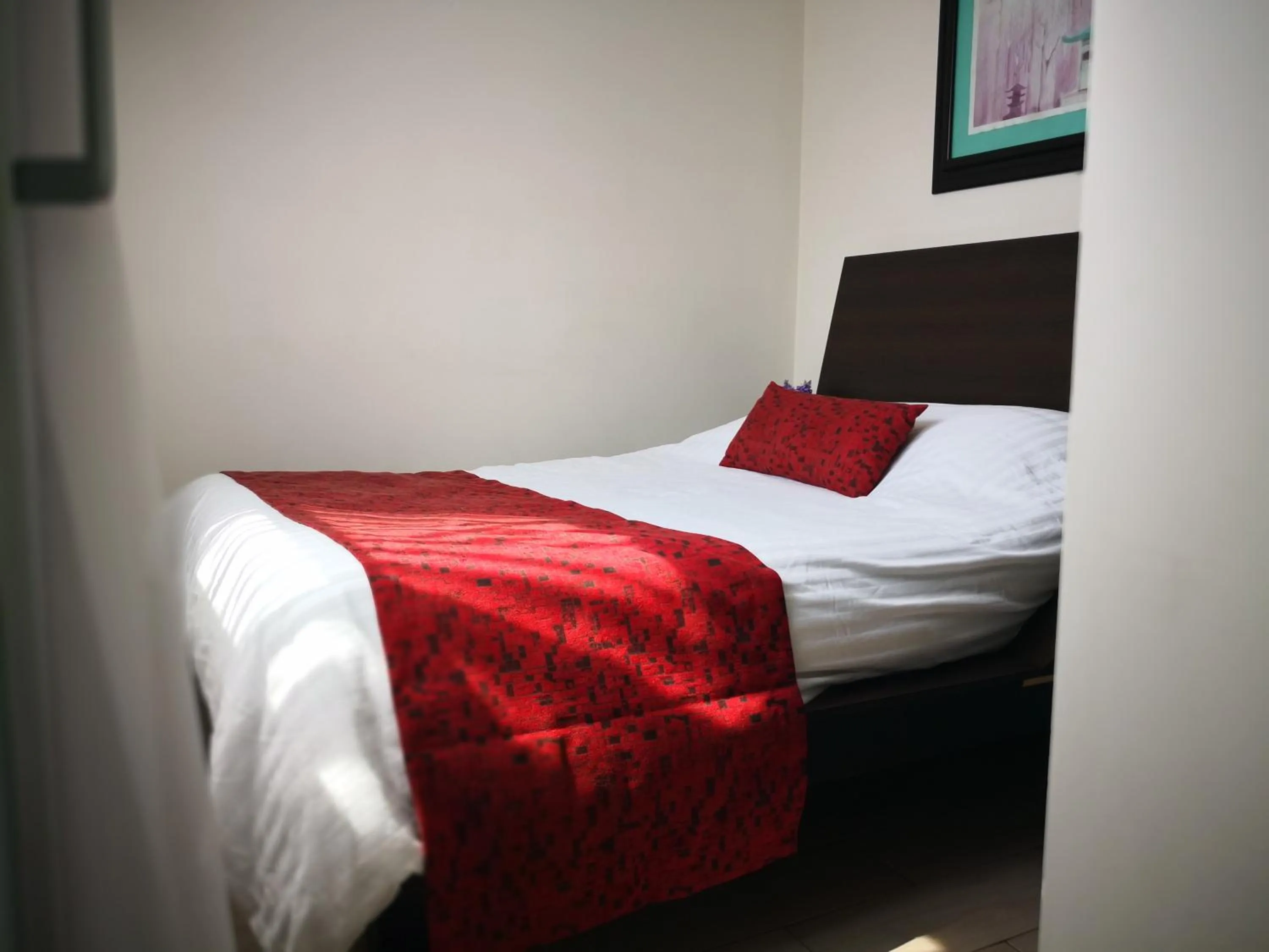 Bed in Metropolis Suites Ejecutivas