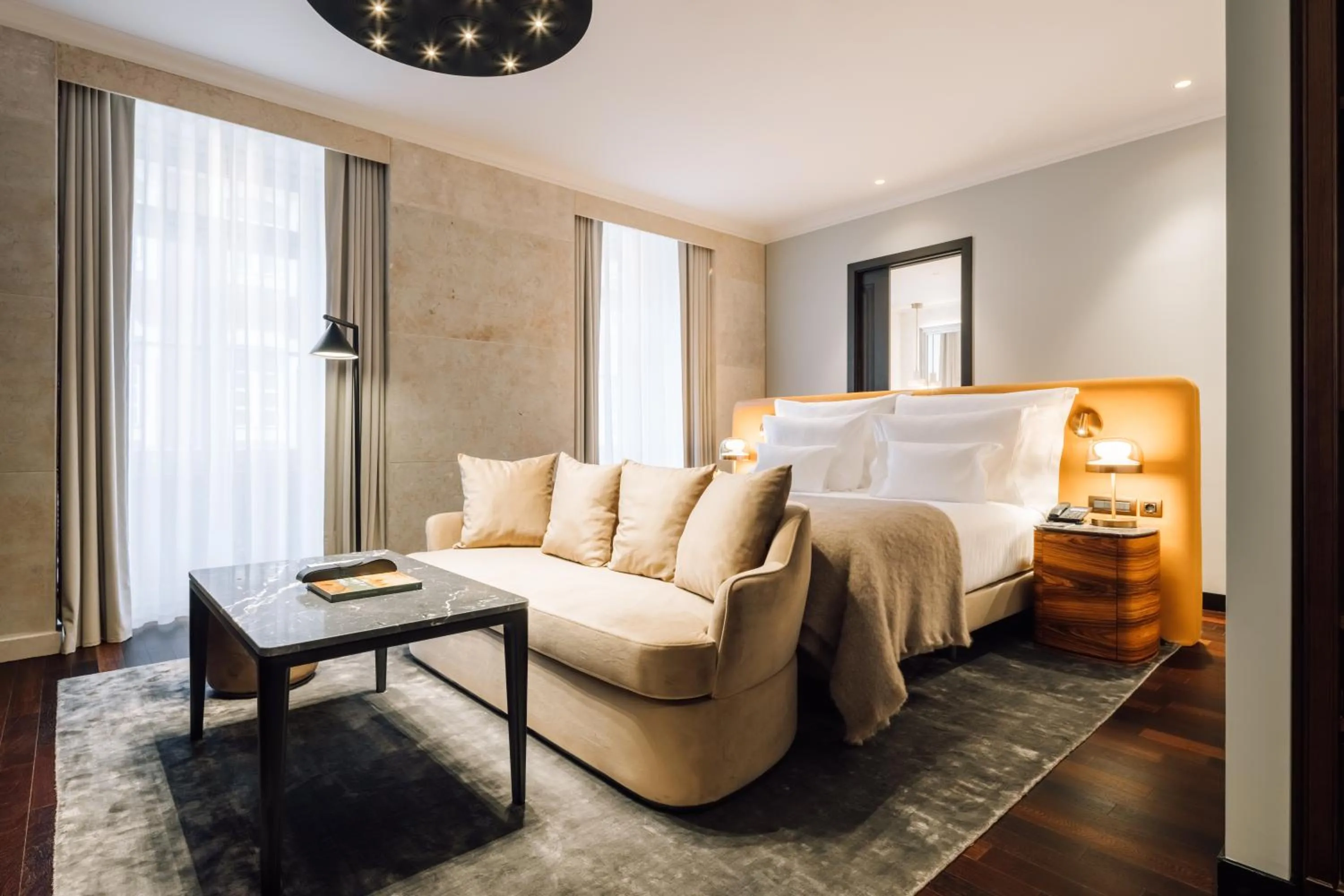 Bed in MYTHIC SANA Downtown Suites
