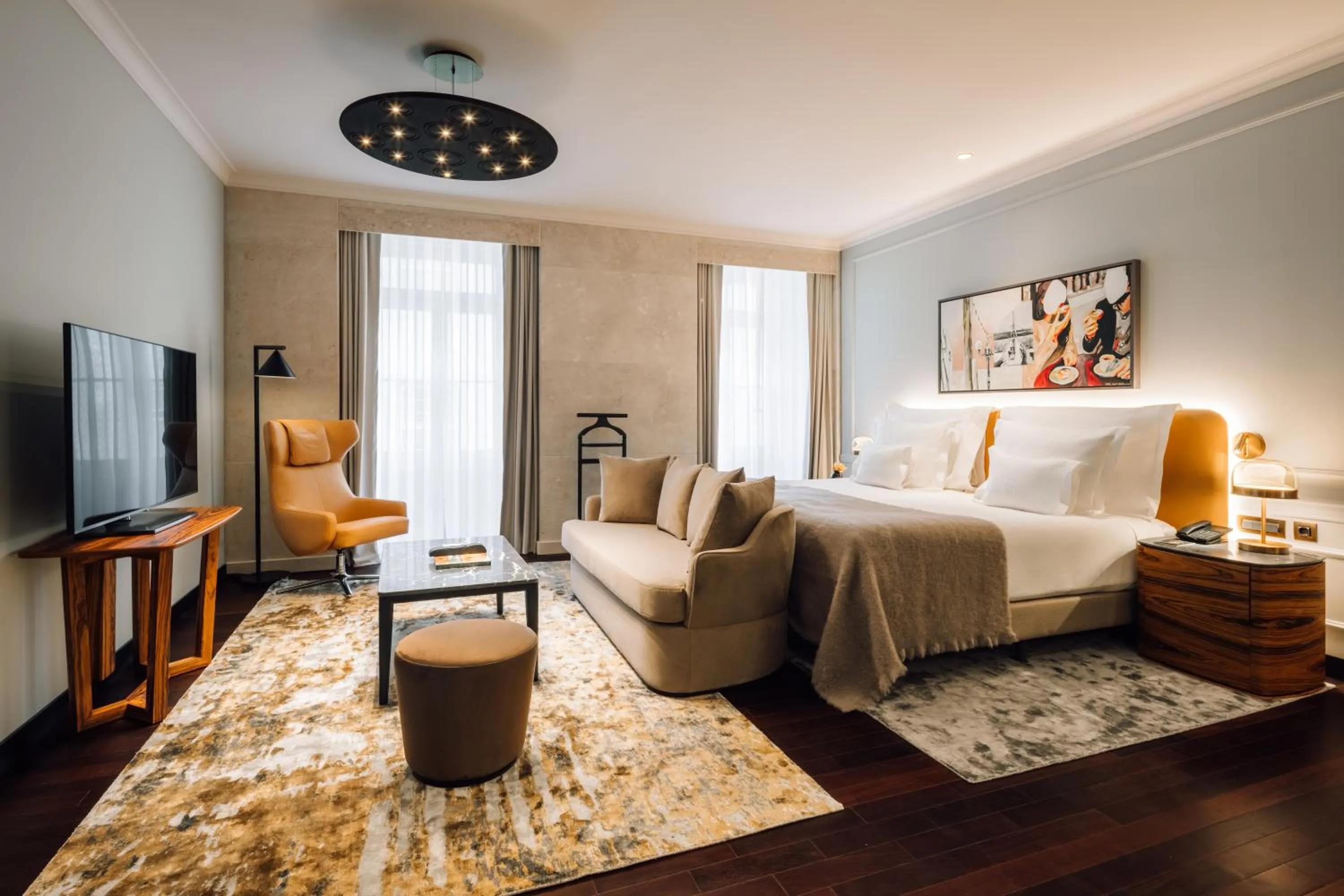 Bed in MYTHIC SANA Downtown Suites