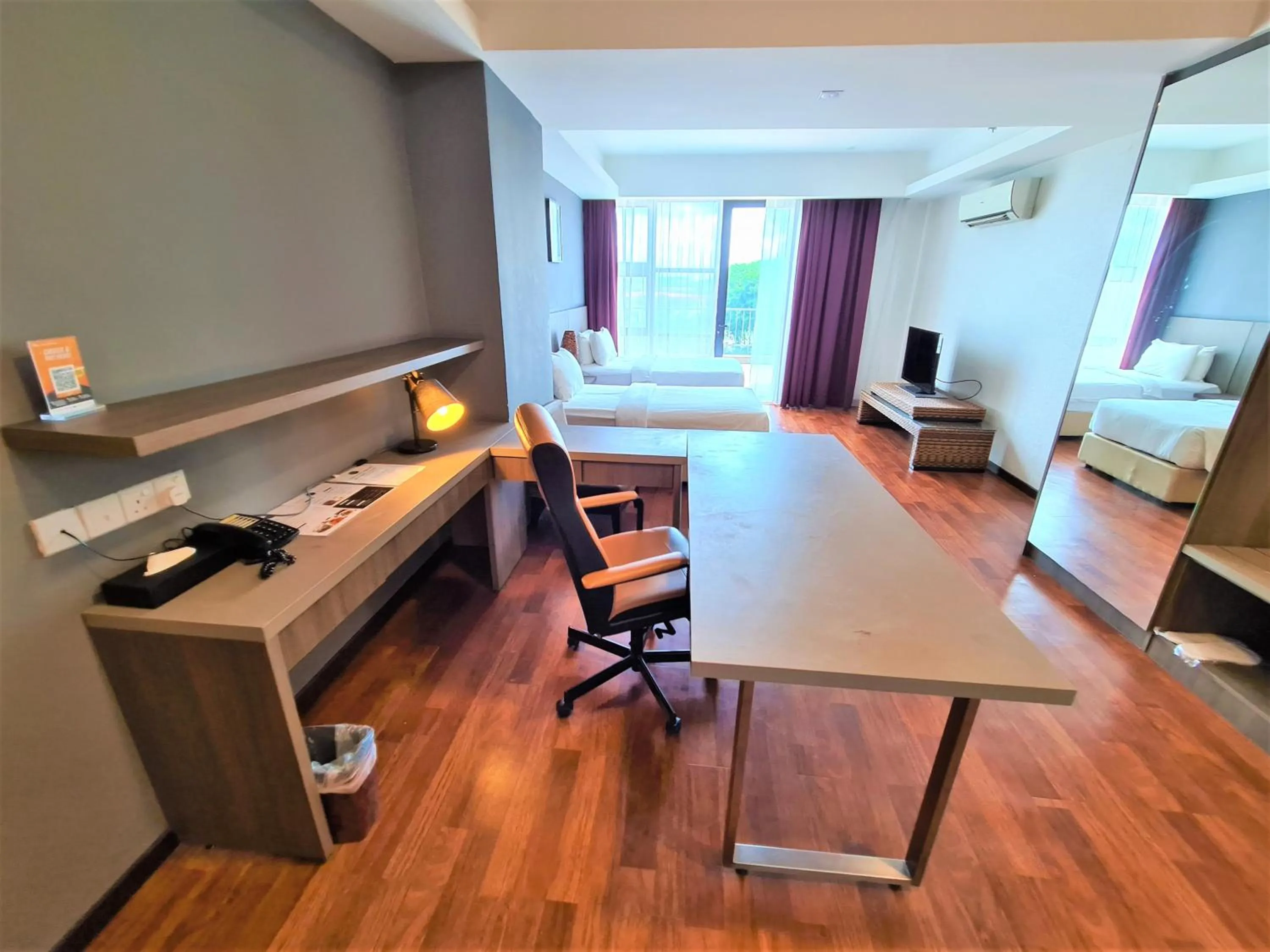 Seating area, Bed in Nexus Business Suite Hotel