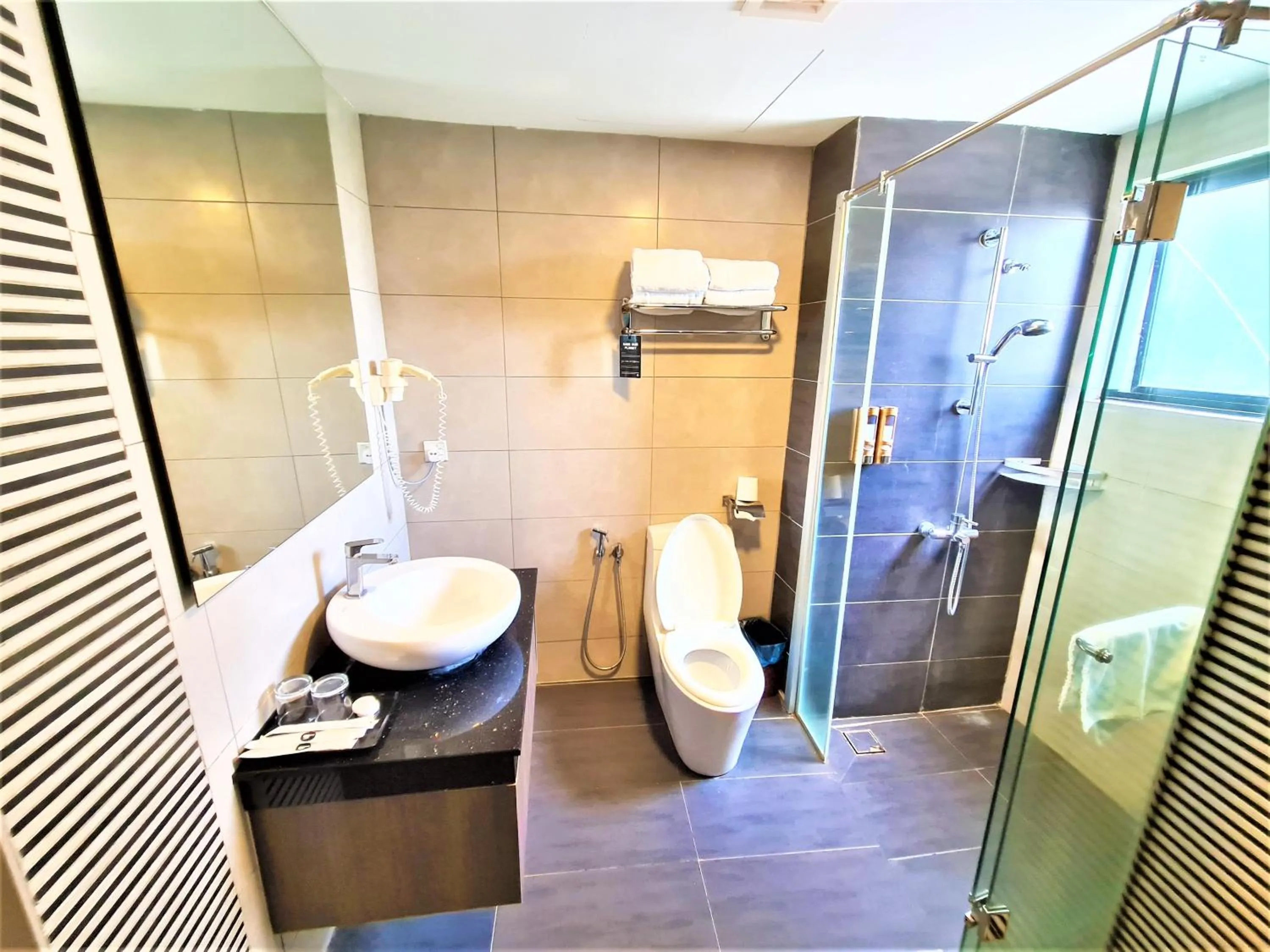 Toilet in Nexus Business Suite Hotel