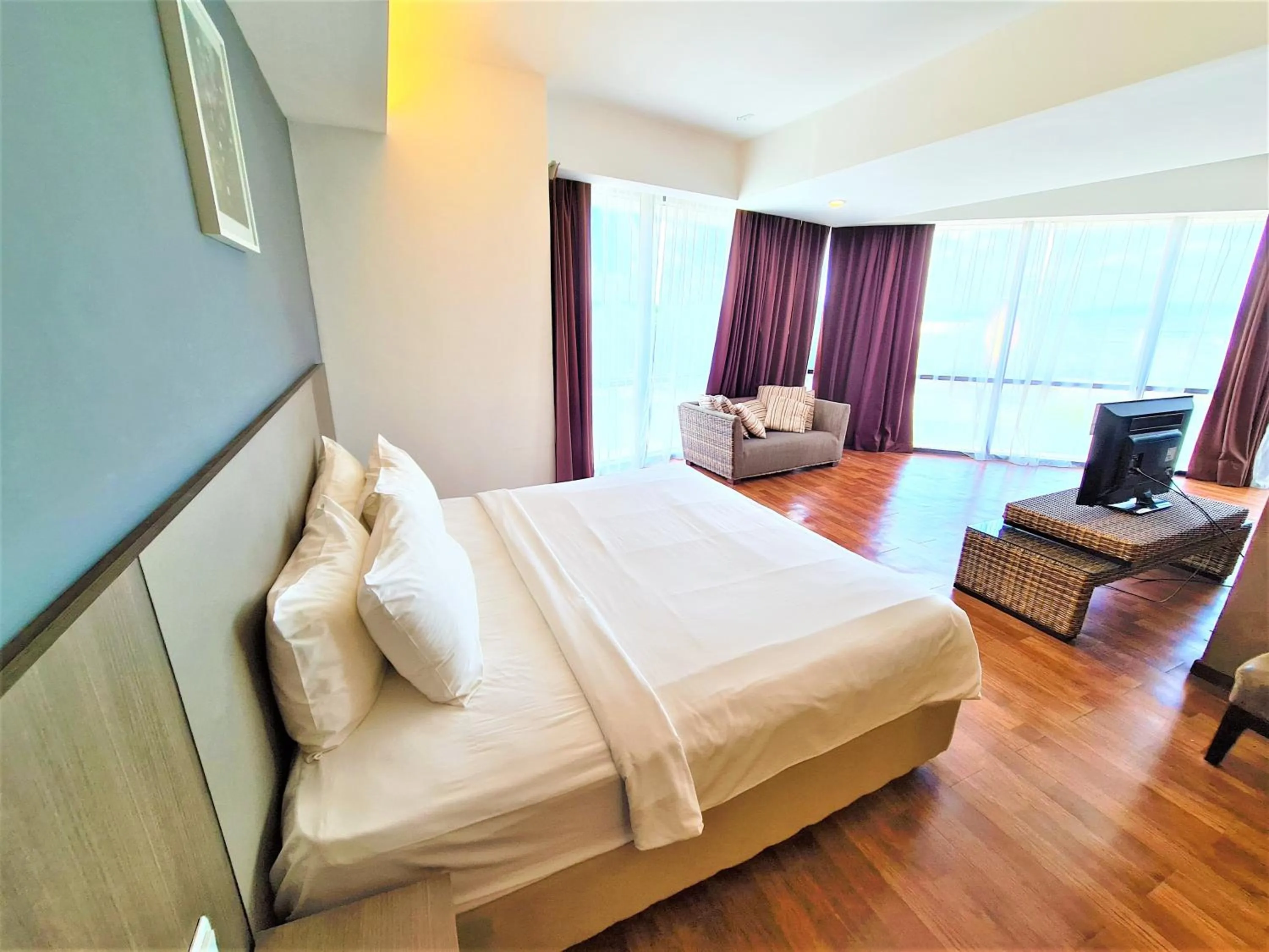 Bed in Nexus Business Suite Hotel