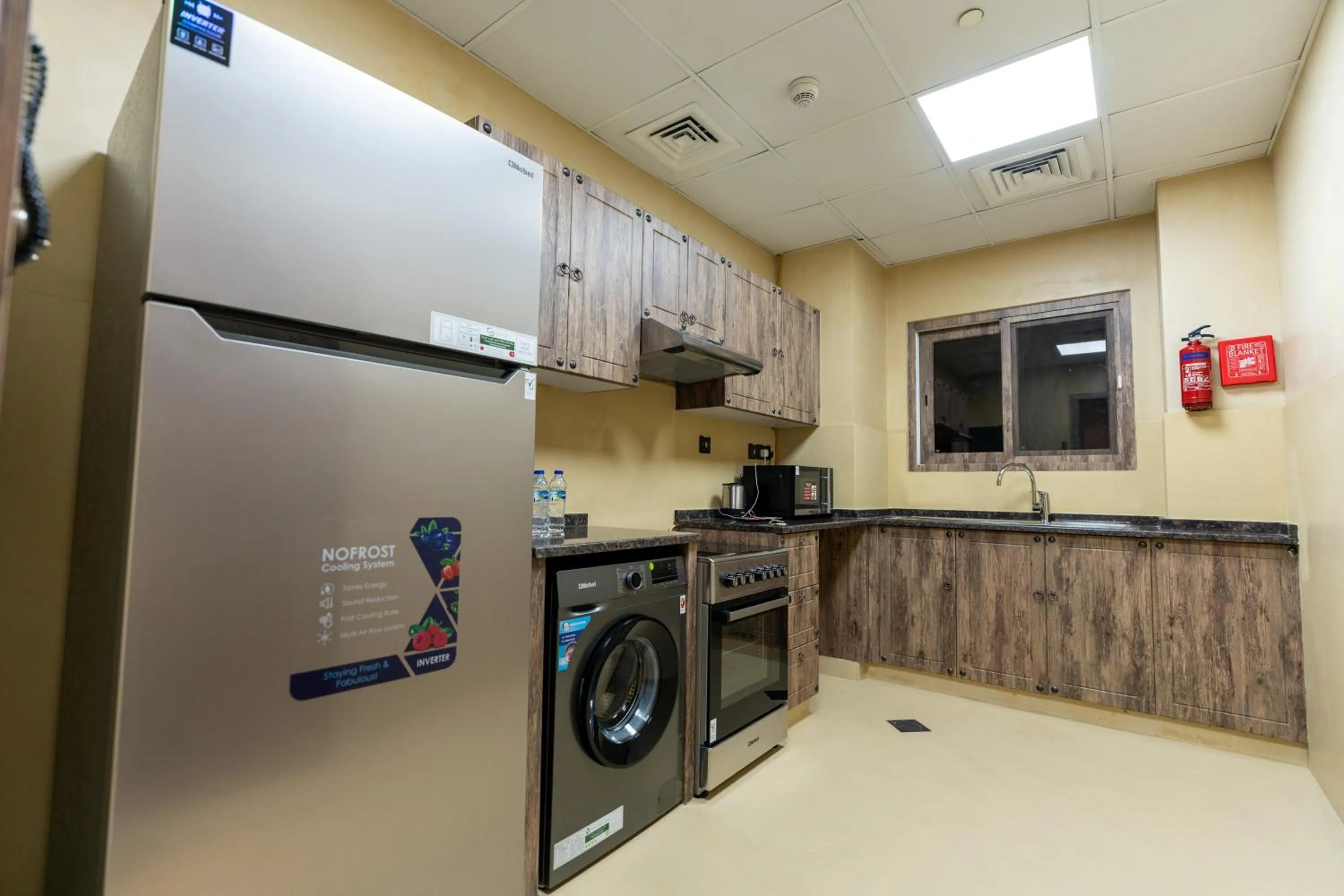Kitchen or kitchenette in The Luxe Retreat Hotel Apartments