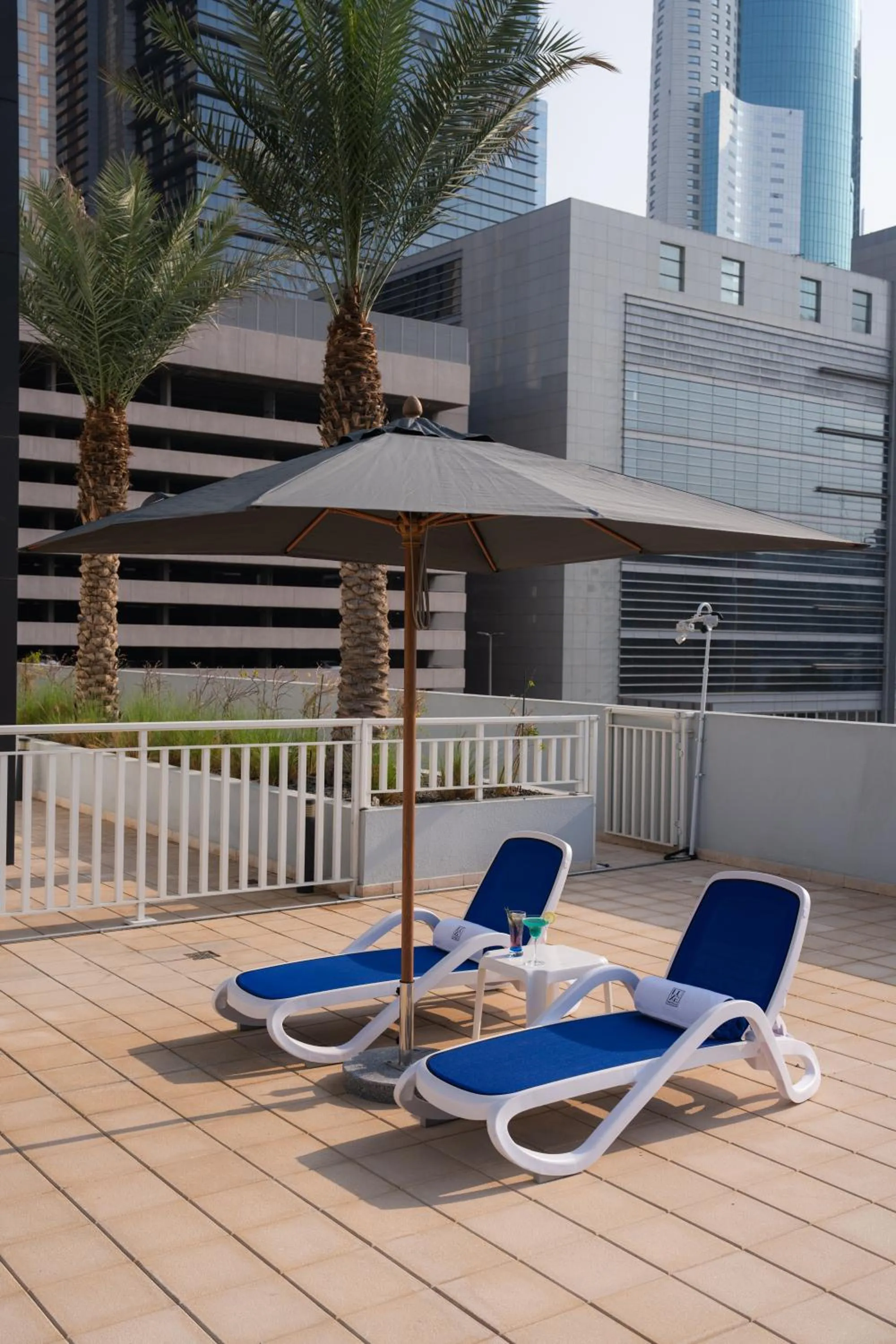Swimming pool in The Luxe Retreat Hotel Apartments
