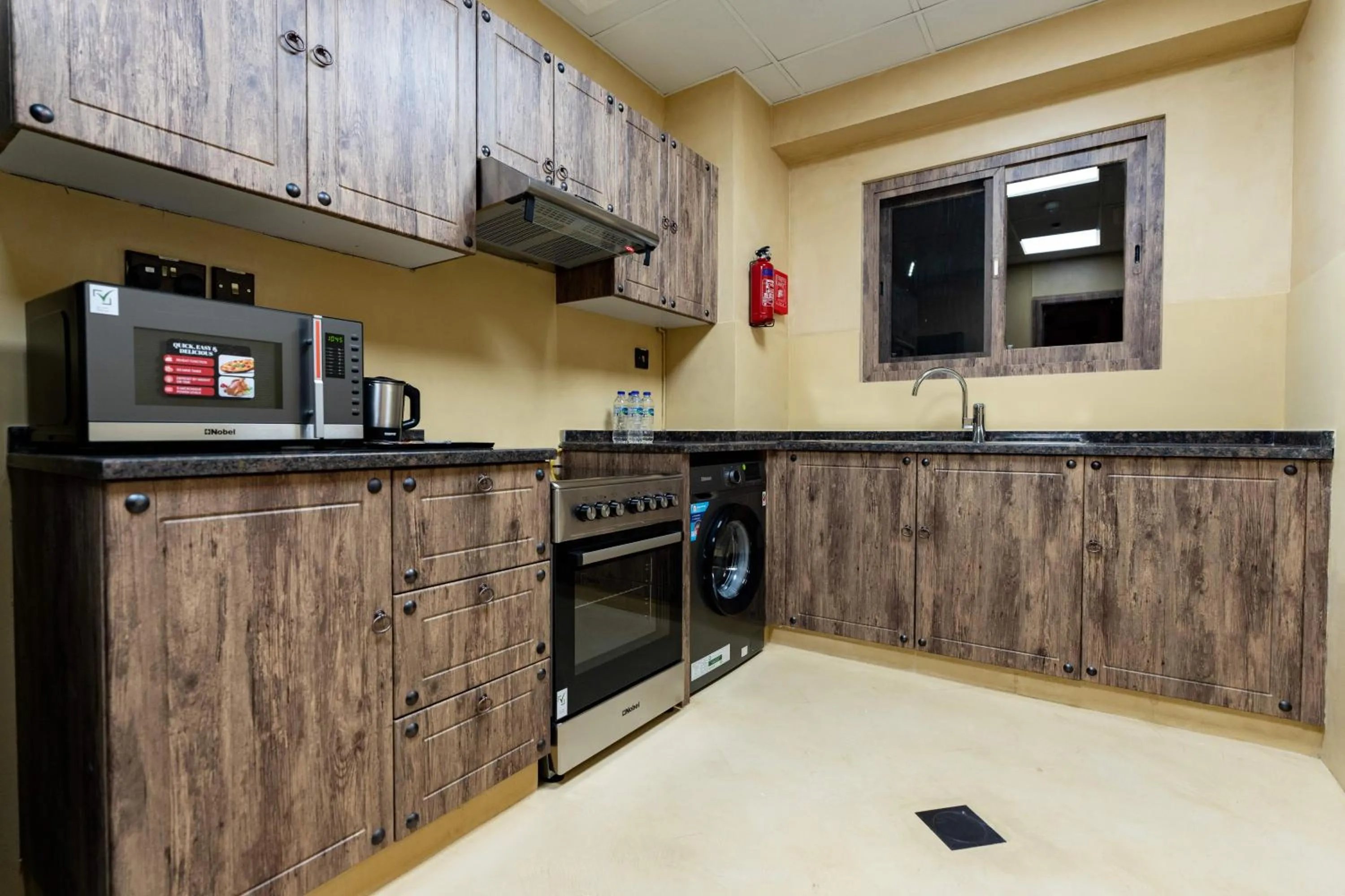 Kitchen or kitchenette in The Luxe Retreat Hotel Apartments