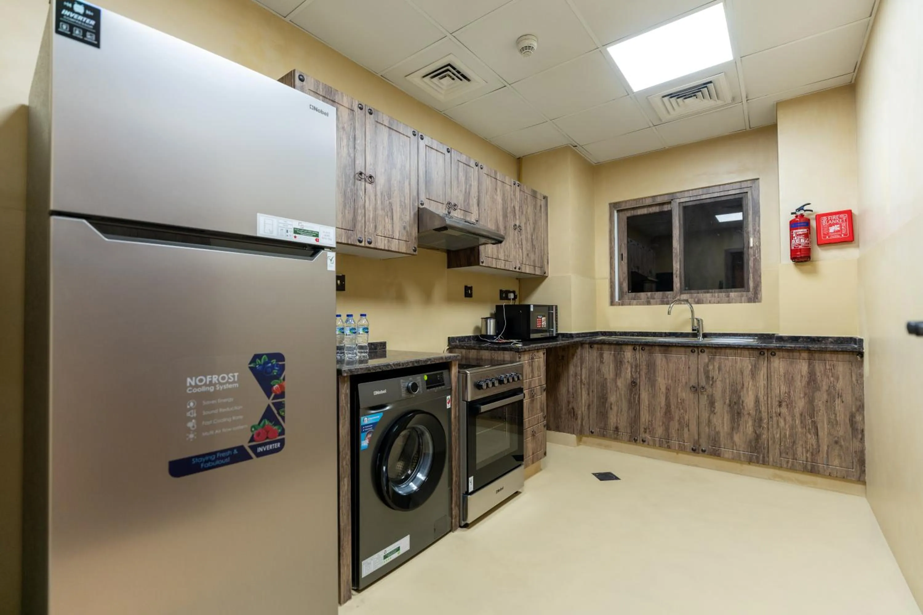 Kitchen or kitchenette in The Luxe Retreat Hotel Apartments