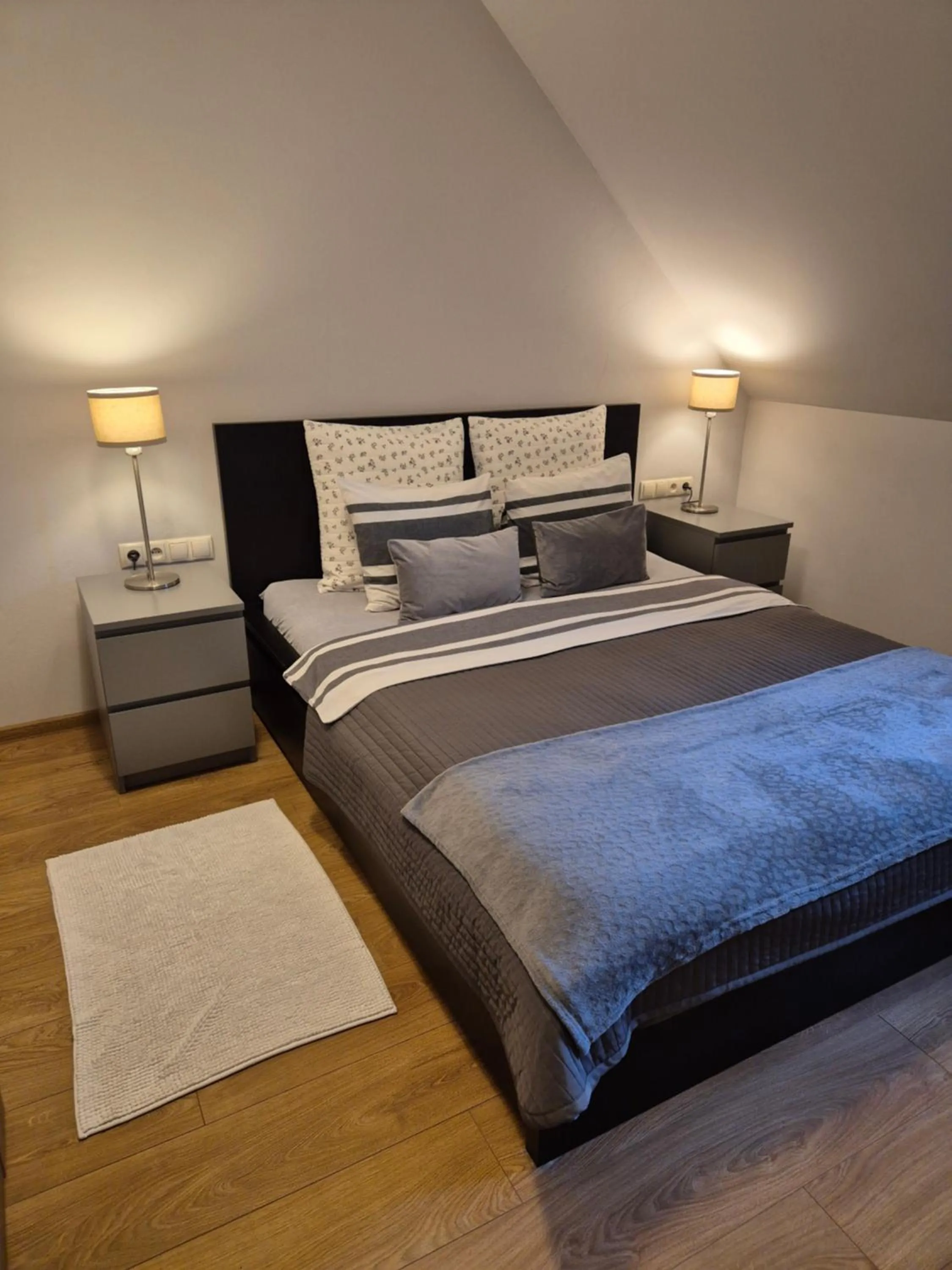 Bed in APARTAMENTY TUŹNIKOWIE