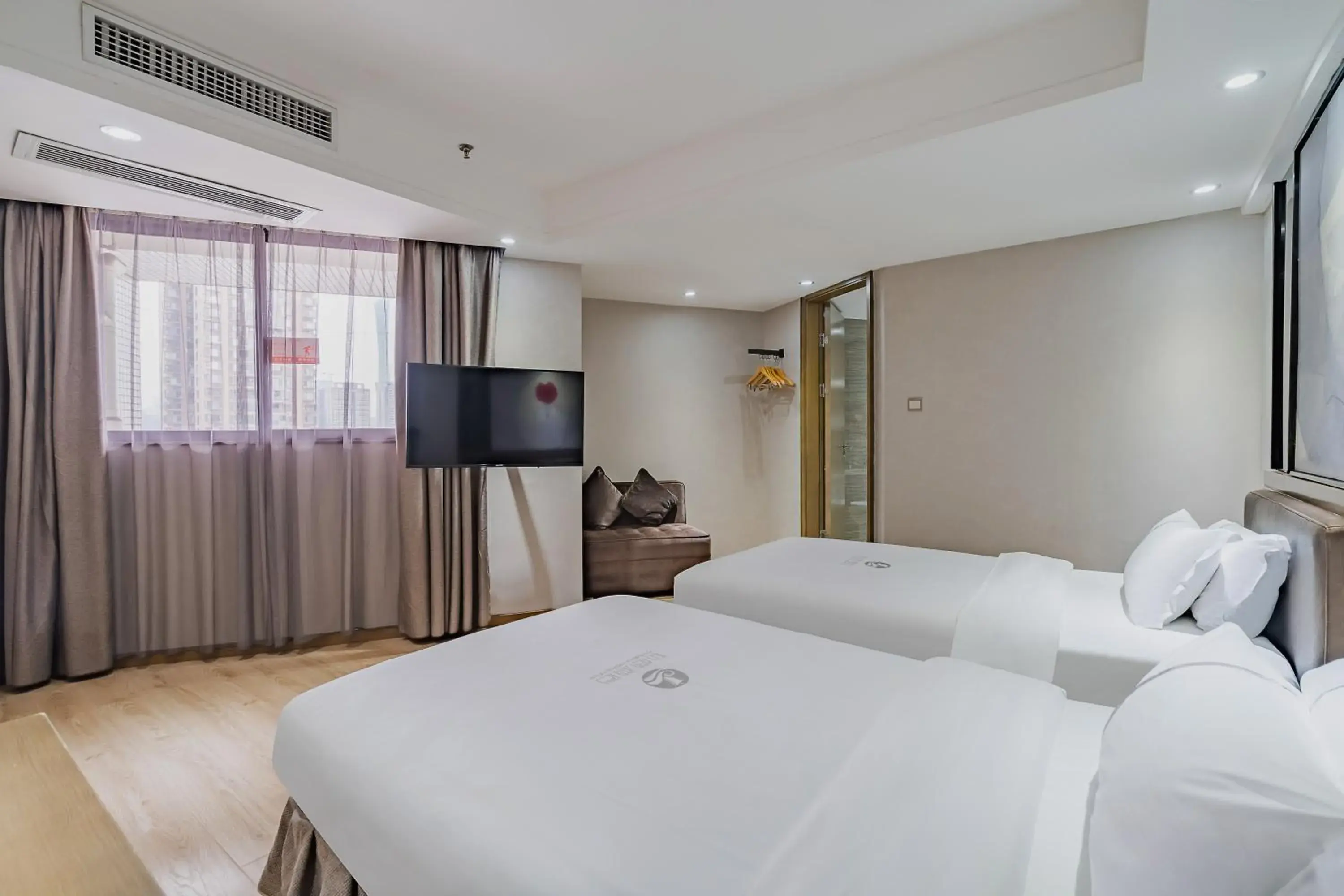 Deluxe Twin Room in Insail Hotels (Pazhou Exhibition Center KeCun Metro Station Dunhe Road Branch Guangzhou) Deluxe Twin Room in Insail Hotels (Pazhou Exhibition Center KeCun Metro Station Dunhe Road Branch Guangzhou)