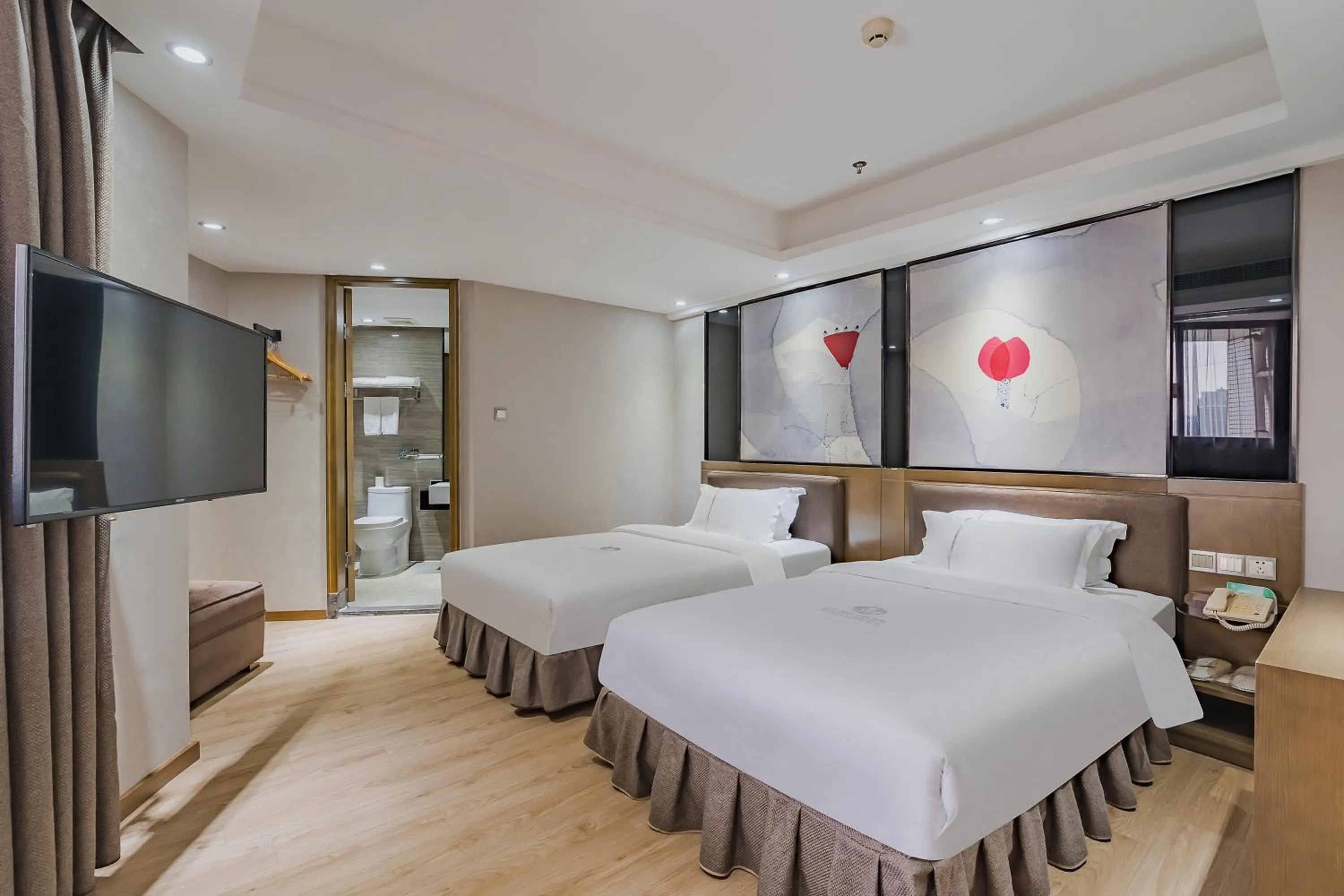 Photo of the whole room, Bed in Insail Hotels (Pazhou Exhibition Center KeCun Metro Station Dunhe Road Branch Guangzhou)