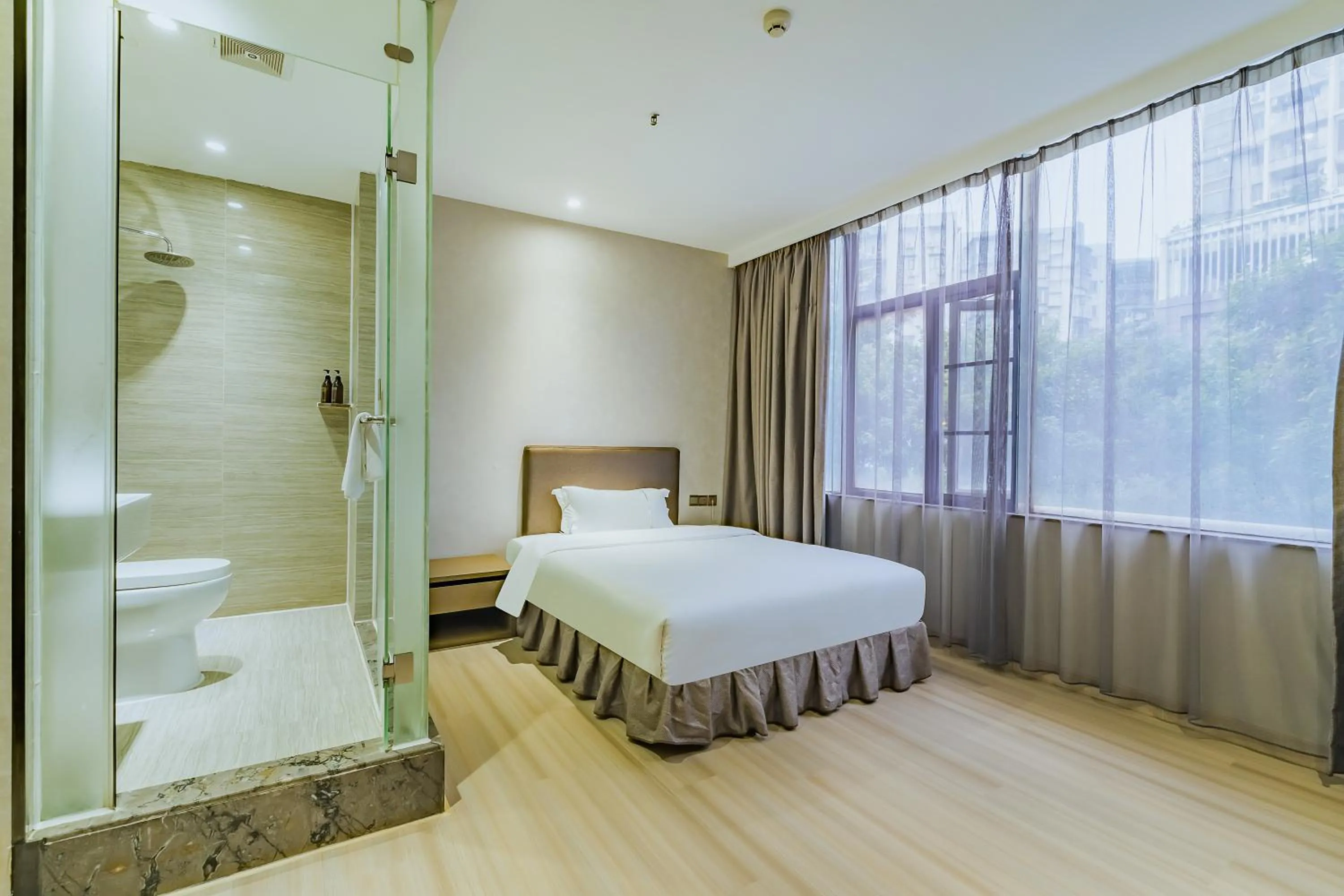 Photo of the whole room, Bed in Insail Hotels (Pazhou Exhibition Center KeCun Metro Station Dunhe Road Branch Guangzhou)
