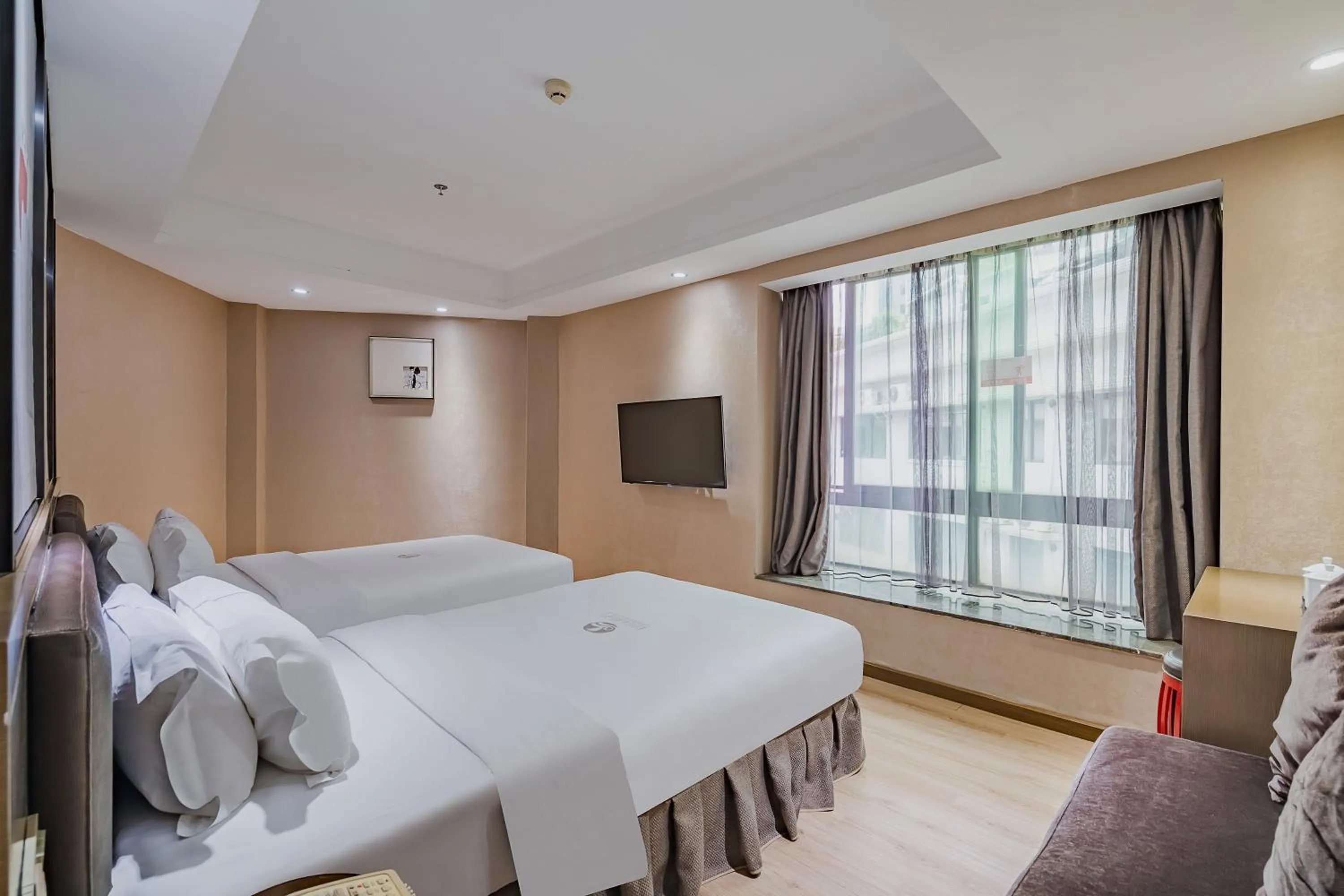 Photo of the whole room, Bed in Insail Hotels (Pazhou Exhibition Center KeCun Metro Station Dunhe Road Branch Guangzhou)