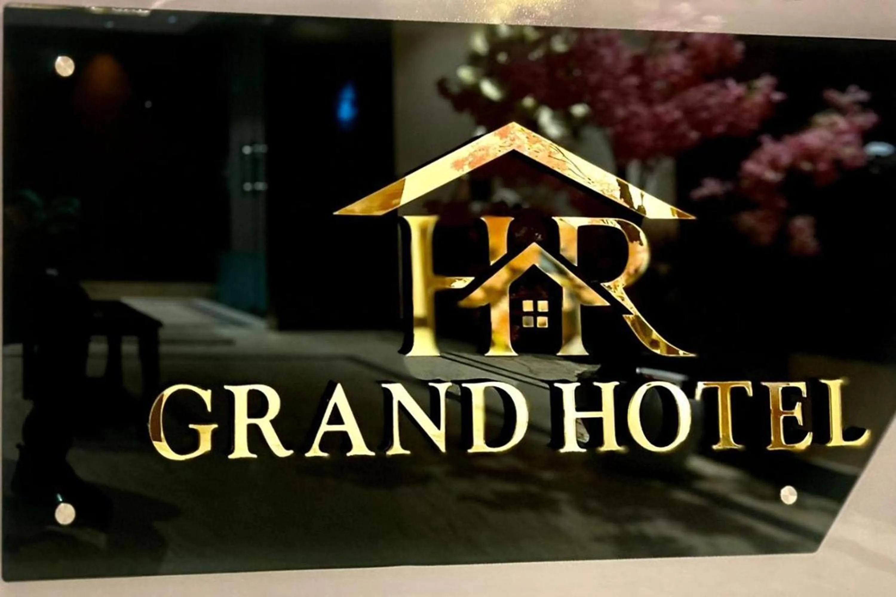Property logo or sign in HR Grand Hotel