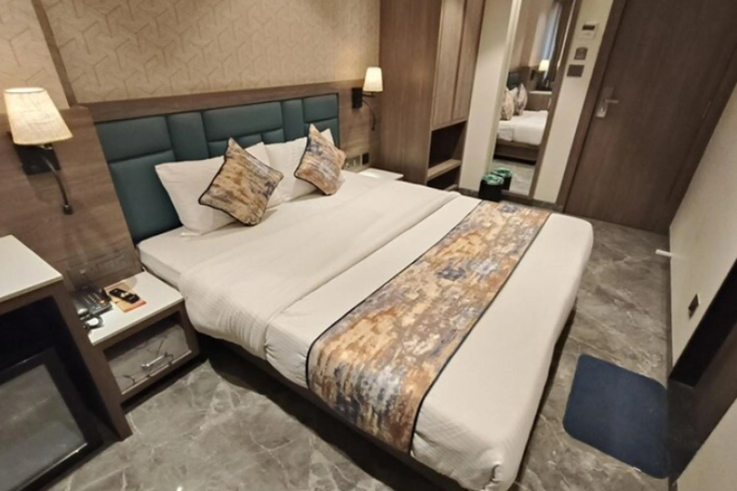 Bed in Dream Residency Hotels Pvt Ltd