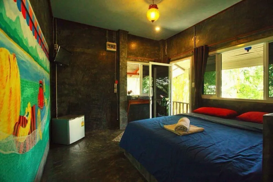 Bed in Sawasdeepai River Resort