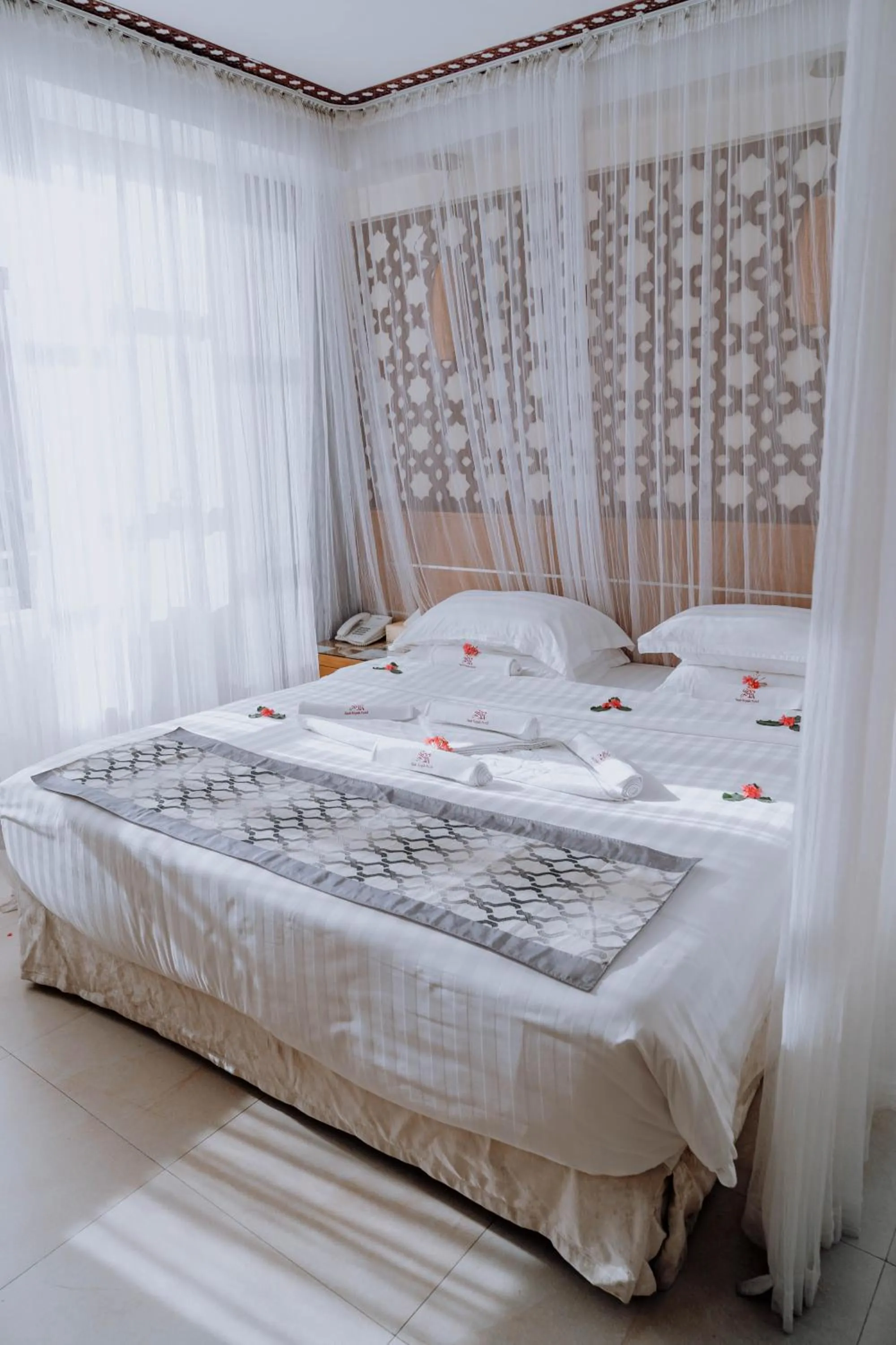 Bed in Saab Royale Hotel