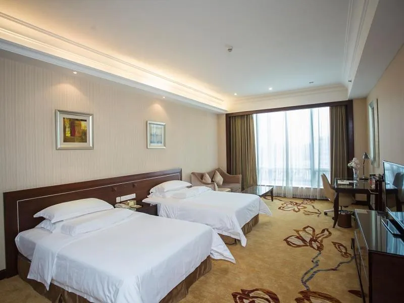 Bed in Vienna International Hotel Shenzhen Hua'nan City