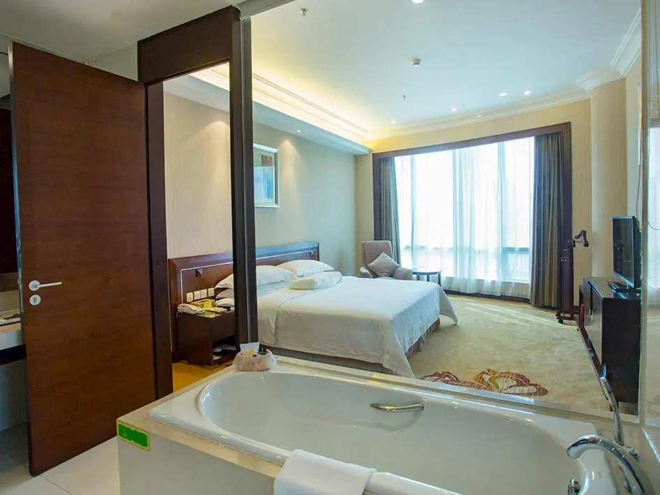 Bed in Vienna International Hotel Shenzhen Hua'nan City