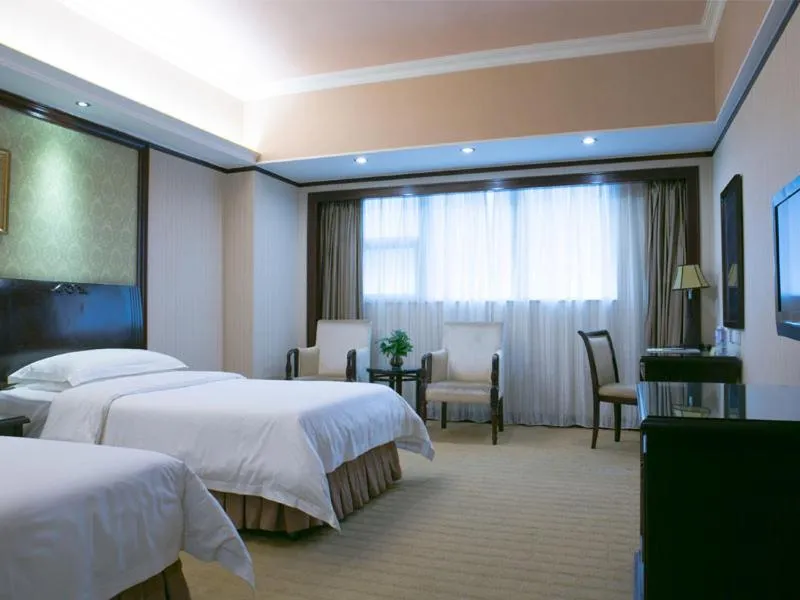 Bed in Vienna Hotel Shenzhen Fuhua Road