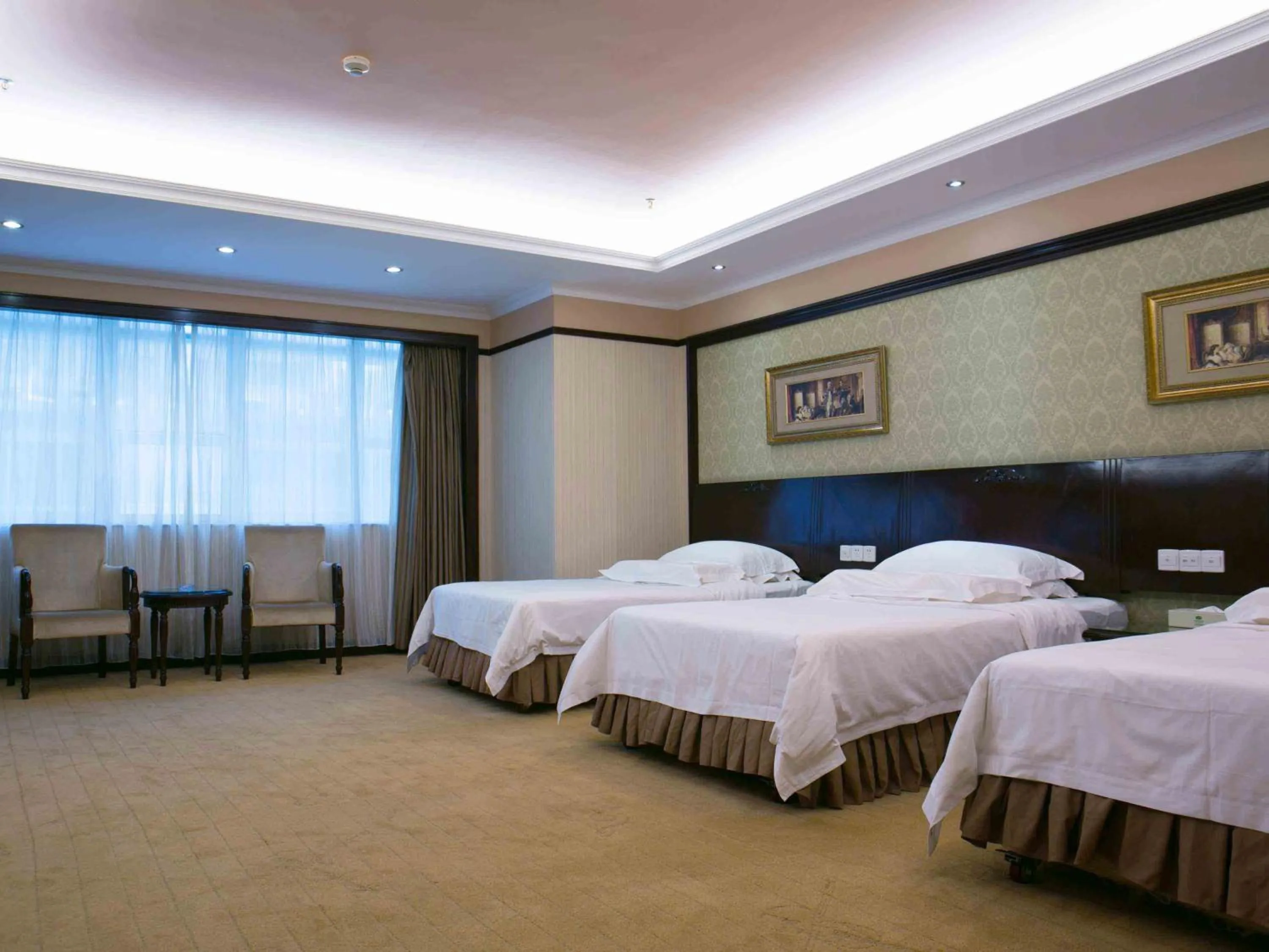 Bed in Vienna Hotel Shenzhen Fuhua Road